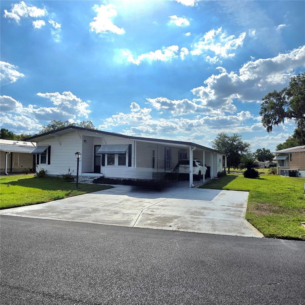 Photo of 6114 Grand Oaks Drive SE, Winter Haven, FL 33884 (MLS # L4961323)
