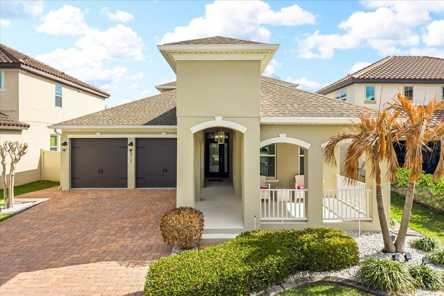 Located in the desirable Windermere Trails community, this beautifully updated and exceptionally well-maintained home offers outstanding curb appeal and a welcoming feel from the moment you arrive. A standout feature of the property is the fantastic backyard retreat highlighted by a heated saltwater pool built in 2022 with a travertine paver deck, screened enclosure with privacy screens, and a vinyl privacy fence for added seclusion. The home also features a fully paid off whole house solar system, providing impressive energy efficiency and long-term savings. Inside, the open floor plan seamlessly connects the living room, kitchen, and dining area, creating a bright and inviting space ideal for both everyday living and entertaining. Elegant porcelain tile flooring spans the entire first floor, while bamboo flooring adds warmth and character upstairs. The primary suite is conveniently located on the first floor and features dual walk-in closets and a well-appointed bath. Upstairs you will find two additional bedrooms along with a versatile loft or bonus room that can serve as a second living area, office, or playroom. The kitchen flows easily to the interior laundry room, and a half bath is located downstairs near the mudroom and main living area for guests. Covered front and rear porches provide additional outdoor living space to relax or entertain. Ideally situated just minutes from top rated schools, shopping, restaurants, Publix, and the attractions of Walt Disney World, this Windermere Trails home offers both convenience and an exceptional lifestyle.