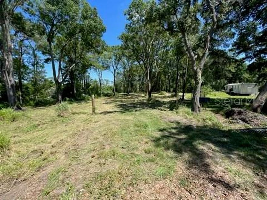 Looking for a large piece of land to build your dream home? Then you will love this 10+ acre wooded lot located in Polk City! The property has been partially cleared with driveway added (about 3 acres) on the SE corner.   You will love the large oaks and secluded feeling that the property has to offer. Bring your own builder or buy now and build later with no time constraints. Enjoy country living while being just minutes away from I-4, shopping and restaurants. There is plenty of extra room for a detached garage or storage area. Horses and cows are welcome and best of all NO HOA! Per Polk County, 
“This property appears to be entirely within a floodplain and wetland area boundary. You would need to demonstrate compliance with the County's Floodplain and Wetland Area Management regulations in order to build on this property. See Chapter 6 of the Polk County Land Development Code for details.  Also, the property is located within the Residential Suburban Land Use district, so setback standards within Chapter 2, Section 205, Table 2.2 will also apply.”