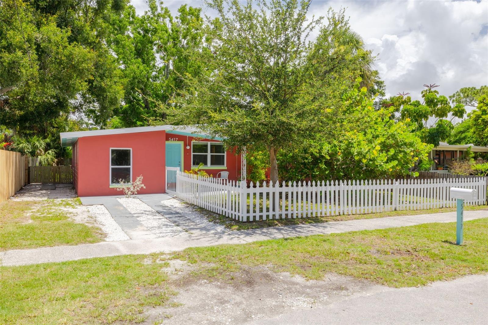 This solid BLOCK construction home is HIGH and DRY in Flood Zone X and Evacuation Zone E, with NO flooding or damage from the 2024 hurricane season. With fresh interior and exterior paint, new kitchen appliances, new ceiling fans, and updated bathroom vanities and toilets, this home is completely MOVE-IN READY—perfect as a primary residence or a smart investment property. Featuring 4 bedrooms and 2 full baths, including a spacious PRIMARY SUITE with an ensuite bath and access to the backyard, the layout offers flexibility for families, roommates, or work-from-home setups. Tile flooring runs throughout most of the home, with NEW cozy carpet in one bedroom. The fully fenced, oversized backyard is ideal for pets, play, or future outdoor entertaining spaces; there's even ROOM FOR A POOL! Other updates include HVAC (2015), electrical panel (2017), roof (2011), and bathroom plumbing updated with copper and PEX piping. Just minutes from vibrant downtown Gulfport, with quick access to the Pinellas Trail, downtown St. Pete, and the Gulf beaches—this is Florida living at its best!