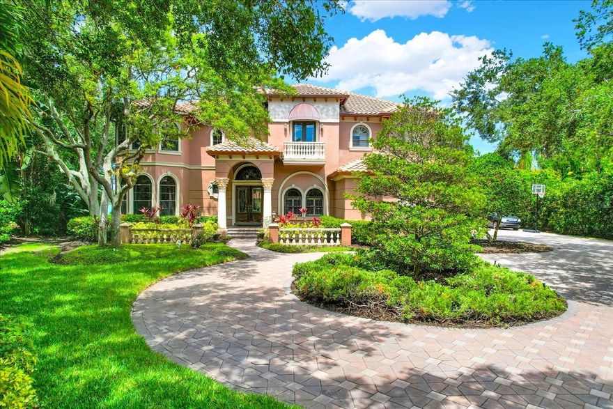 DON’T MISS OUT ON THIS EXCEPTIONAL OPPORTUNITY TO MAKE THIS RARE AND BEAUTIFUL WATERFRONT ESTATE IN THE GATED COMMUNITY OF BAYOU CLUB YOURS! NESTLED ON 1.62 ACRES OF LAND, NEXT TO A SERENE NATURE PRESERVE, THIS PROPERTY OFFERS AN UNPARALLELED PRIVACY AND DIRECT ACCESS TO A 25-ACRE BRACKISH LAKE THAT FLOWS INTO THE INTRACOASTAL WATERWAY! This home offers the perfect outdoor setting for fishing, kayaking, paddle-boarding, or jet skiing, complete with both a composite fishing dock and floating dock for easily launching water toys. Step inside and discover 5,800 Sq Ft of exquisite living space, with high ceilings, plantation shutters, crown molding, and premium finishes in every room. The expansive floor plan is ideal for entertaining and multi-generational living. The 1st floor features an open-concept chef’s kitchen with a large breakfast bar, dining nook, butler’s pantry, granite counters, and a natural gas cooktop- perfect for gatherings of any size. The lower-level floorplan has been masterfully designed, complete with 2 guest bedrooms + study, pool bath, a laundry room, formal dining room, and family room. The elegant living room is simply dazzling, with coffered ceilings, a gas fireplace, floor-to-ceiling sliders to the pool area, and new porcelain tile floors. The 1st floor study is perfect for remote work, adorned with beautiful built-in wood cabinetry, coffered ceilings, wood floors, and a double-door entry with solid-core doors. Upstairs, the GRAND MASTER SUITE is flooded with natural sunlight, boasting his/hers closets, tray ceilings, and a HUGE master bath with a jetted tub and steam shower. Soak up panoramic views of the pool and backyard from the large balcony with BRAND NEW TRAVERTINE TILE and private access from the master suite. There are 3 more large bedrooms upstairs plus a den, all with high ceilings, walk-in closets, solid core wood doors, and crown molding details. The upper level could easily accommodate visiting guests and relatives, thanks to the additional living room/game room area and 2nd floor laundry room! Enjoy year-round outdoor space from the heated lagoon-style saltwater swimming pool that overlooks the lake, complete with a spillover hot tub, pebble finish, waterfall feature, and outdoor kitchen/gas grill area. THE EXTERIOR OF THE HOME WAS COMPLETELY REPAINTED IN NOV 2024! The massive amount of green space is perfect for pets, kids, outdoor activities and more! Park up to 4 vehicles in the garage, equipped with a Tesla electric car charging station. Schedule your private tour of this custom-built estate today and make Bayou Club your next home! *No Storm Damage or Flooding*