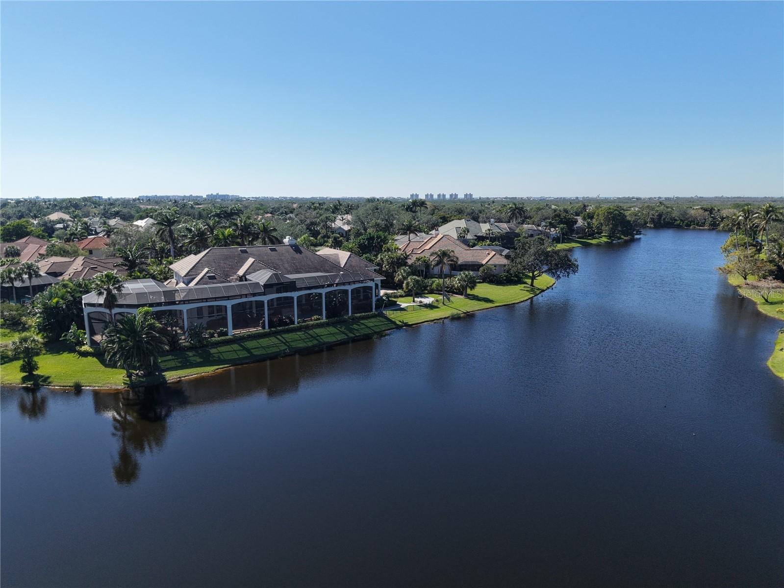 PRICE REDUCTON!! Welcome to Paradise! Situated in Bonita Bay in a prime area of Bonita Springs off US 41, this top-notch community boasts a private beach club on Bonita Beach, miles of walking and jogging paths, immense foliage, several community parks, Backwater Jacks with boating and dining and an array of other amenities. This home is huge with 7,838 SF under air and a total of 16,073 SF of complete space for your enjoyment; see floor plan attached to the MLS. The highlight of this estate home is the custom-designed pool facility which was featured in a previous issue of Naples Illustrated Magazine. Spend tranquil days enjoying 5 waterfalls, a swim up bar, 3 fire features, 2 lovely bridges, a heated spa, and a pool water slide! The home was built, added on and has been continuously maintained over the years by the top Southwest Florida Builder, Harwick Homes, who is known for having built some of the most opulent properties in the area. The property sits at the end of a cul-de-sac on a .70 AC lot with a wonderful water view facing north. A roomy full 4 car garage can comfortably house your personal car collection. The interior of the home has a huge master suite, a large den, home theater, a dedicated workout room, 4 bedrooms with 5 full bathrooms and 2 half baths! Highlighting the main living area is a 30’ Florida Keystone Fireplace as the main focal point of the multi-room living space. The current owners spared no expense in the upkeep of this wonderful property. Make your appointment now to see what is considered to be a super opportunity to purchase this estate home!