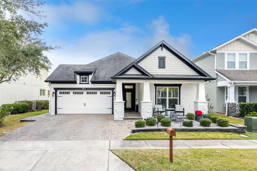 Thoroughly refreshed Calypso model by David Weekley Homes in the heart of the Lake Nona area’s Randal Park—a neighborhood known for its resort-style amenities, miles of scenic trails, and an unmistakable sense of connection. This craftsman-style home delivers the perfect balance of luxury, comfort, and everyday livability. From the moment you arrive, the beautifully landscaped front yard and stone-accented façade set the tone for what’s inside. Step through the glass front door and you’re greeted by an airy, light-filled interior where offset tile flooring, 8-foot doors, crown molding, and custom lighting create a refined yet welcoming atmosphere. The open-concept design flows effortlessly, perfect for hosting dinner parties or relaxed evenings with family. At the heart of the home is the renovated gourmet kitchen, featuring quartz countertops, white 42” cabinetry, an oversized island, stainless steel appliances, a built-in oven and microwave, and a striking baroque tile backsplash. Whether it’s casual breakfasts or holiday celebrations, this open kitchen, dining, and living area keeps everyone connected. The living room is upgraded with a stone accent wall and electric fireplace. The first-floor primary suite is a true retreat, offering privacy and space to unwind. The renovated spa-inspired bathroom showcases marble flooring, quartz counters, dual sinks and makeup vanity, a glass-enclosed shower, and a freestanding tub. The custom walk-in closet, complete with built-ins and a chandelier, feels straight out of a luxury boutique. Just steps away, the first-floor laundry room with utility sink and folding counter adds everyday convenience. The two additional first-floor bedrooms are split to the front of the home for privacy and share a refreshed bathroom with new flooring, quartz vanity, and custom lighting. A separate flex room with French doors provides the perfect home office space, creative studio, playroom, or library. Upstairs, a large bonus room with a full third bathroom offers immense flexibility—ideal as a 4th bedroom, media room, guest suite, or playroom. Step outside and discover your own Florida oasis. The extended screened-in lanai, brick paver patio, and fenced backyard invite year-round outdoor living. Fire up the impressive summer kitchen with granite backsplash, Blackstone griddle, cooktop, and outdoor refrigerator, gather under the pergola, or enjoy cozy evenings around the fire pit. This backyard was made for relaxed weekends and unforgettable gatherings. Beyond your front door, Randal Park offers a lifestyle few communities can match: a resort-style pool, clubhouse, splash pad, fitness center, dog parks, playgrounds, and miles of jogging, walking, and biking paths surrounded by over 300 acres of preserved green space. Top-rated Sun Blaze Elementary is a short walk from this home, adding to the everyday ease. Ideally located minutes from Medical City, Lake Nona Town Center, USTA National Campus, SR 417, SR 528, and Orlando International Airport, with quick access to downtown Orlando, theme parks, and beaches. Built with David Weekley’s EnergySaver construction, this home also features Low-E double-pane windows, radiant barrier, and a high-efficiency 14 SEER HVAC—ensuring comfort and lower utility costs. Life at 8816 Andreas Avenue is about more than a beautiful home—it’s about enjoying space, connection, and a vibrant Lake Nona lifestyle. This is the one you’ve been waiting for. Schedule your private showing today.