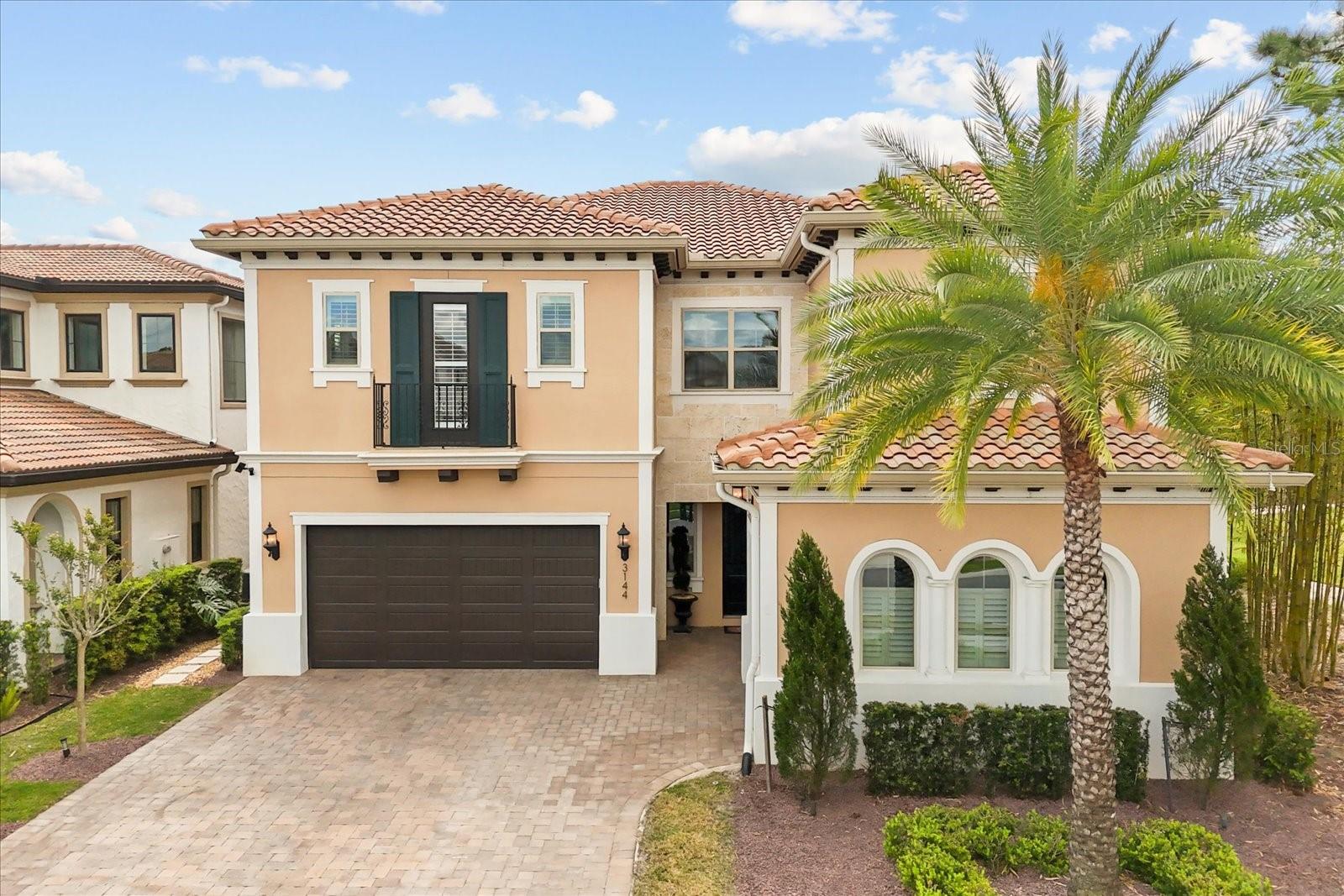 Welcome to 3144 Players View Circle, a stunning executive home in the exclusive guard gated community of Reserve at Alaqua.
This elegant Fitzgerald model features 5 bedrooms, 5.5 bathrooms and around 4,000 sq ft of luxury living, including an oversized driveway and a 3-car garage equipped with an EV charger.
Step inside to engineered hardwood floors and a bright, open layout filled with upscale finishes. The gourmet kitchen is a chef’s dream, with light cabinetry, stone countertops, a natural gas cooktop and a farmhouse sink. A massive walk-in pantry and butler’s pantry make entertaining effortless.A temperature-controlled wine room adds a refined touch, holding over 200 bottles.
Enjoy meals in the formal dining area or relax in the spacious family room. A private office with built-ins provides the ideal work-from-home space.
The first floor also includes a guest suite with its own en suite bath and the 2nd floor, a second family room with a wet bar expands the living space.
Three additional bedrooms each have private bathrooms.
The luxurious primary suite features a spa-like en suite with garden tub, walk-in shower, and two custom closets.
Step outside to your personal oasis with a saltwater, gas-heated pool and spa.
An outdoor kitchen and covered patio create the perfect entertaining space.
The landscaped backyard offers both privacy and beauty.
This home sits next to a peaceful park and is close to the driving range and clubhouse.
Enjoy access to a Gary Player-designed golf course and 24/7 guard-gated security.
Located near top-rated schools including Heathrow Elementary and Lake Mary High.
This home blends luxury, comfort, and lifestyle—don’t miss your chance to make it yours.