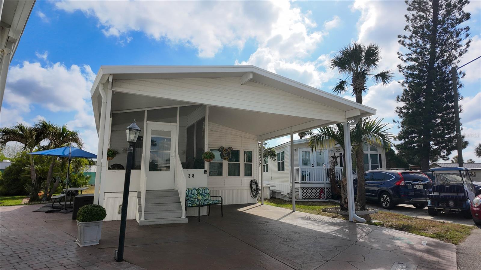 WELCOME TO YOUR PERFECT FLORIA RETREAT! Located in a highly desirable 55+ guard-gated community, this well maintain 2-bedroom, 1 bathroom home offers comfort, convenience, and resort-style living. Step inside to an inviting open-concept layout featuring a spacious living room, very functional kitchen with a cozy dining area. high-quality flooring throughout and double pane windows in every room, bridging in plenty of natural light while keeping utility cost low. Recent upgrades include a new membrane roof (2023), a new washer and dryer set (2024), and a new hot water tank (2024) Enjoy Floria's beautiful weather in the screened-in front porch, fully furnished and complete with an outdoor freezer- perfect for relaxing or entertaining guest. HOA is $691 quarterly includes: Water, Sewer, Cable, Trash, Lawn care, 24-hr security & resort-style amenities like Two heated pools, 9-hole golf, Tennis & Pickleball courts, and access to Lake Davenport for boating and fishing enthusiasts. This property is just a few steps away from bath house #5, which also has a laundry facility.
REMEMBER YOU OWN THE LAND! Don't miss this perfect Florida retreat.