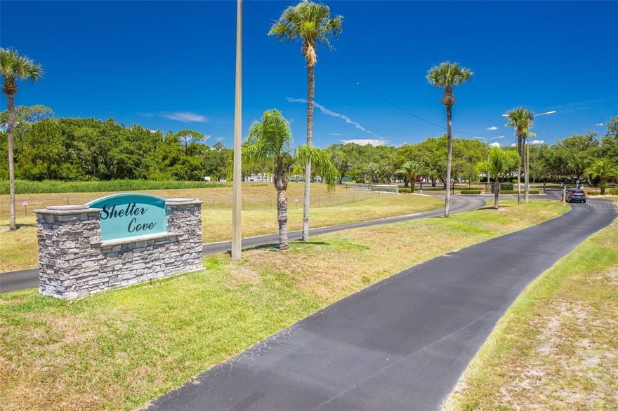 SHELTER COVE, GATED COMMUNITY situated on Center Lake with direct access to the Chain of Lakes. Vacant Lot with new Concrete Pad and Storage Shed. Camper not included in sale. Tucked within a sprawling 150-acre community, Residents enjoy an array of amenities including a community pool, clubhouse, boat launch, walking trails, shuffleboard, basketball court, fitness center, and laundry facilities. The monthly association fee of $180 covers water, sewer, and trash services. Spacious lot, currently rented for $800/month with lease expiring January 31, 2026. Ideal for snowbirds or savvy investors, there are no age restrictions or minimum rental periods. Community allows park model mobile homes, campers, and RV's. Prospective tenants undergo a thorough background check. Call today to schedule your showing!