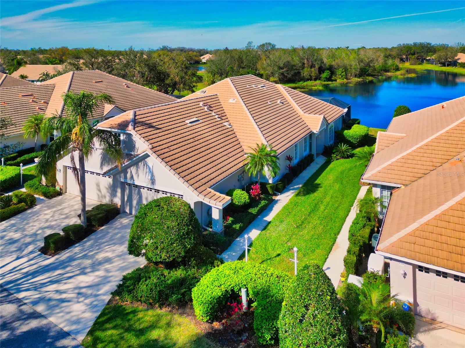 LAKEWOOD RANCH COUNTRY CLUB – PRIVATE POOL & WATER VIEW!
Experience the unparalleled lifestyle of Lakewood Ranch Country Club, where elegance meets resort-style living. Nestled within the secure gates of the Weston community, this spacious, move-in-ready villa offers breathtaking water views and a private pool, setting it apart from the rest.
Step inside to find a freshly painted interior with soaring ceilings, neutral tile floors, crown molding, and an open-concept layout designed for both comfort and sophistication. The gourmet kitchen boasts solid surface countertops, wood cabinetry, and stainless steel appliances—perfect for any home chef. The primary suite offers a peaceful retreat with serene water views, large closets, and a spa-like ensuite featuring a soaking tub and dual vanities. Two additional bedrooms and a second full bath provide ample space for guests or a home office.
Relax on the screened lanai, where you can soak in the tranquil scenery or take a dip in your private pool. Beyond your doorstep, enjoy access to three championship golf courses, tennis courts, a state-of-the-art fitness center, and two upscale clubhouses. Prefer something more laid-back? Stroll or bike along the scenic trails, or take a refreshing swim at the community pool.
Located just minutes from shopping, dining, and Main Street events, this home also offers easy access to Sarasota’s beautiful beaches, downtown, and the airport. Discover the perfect blend of luxury, privacy, and convenience in this exceptional Lakewood Ranch villa.
Make sure to click on the virtual tour button to check out the 3D tour of the home.