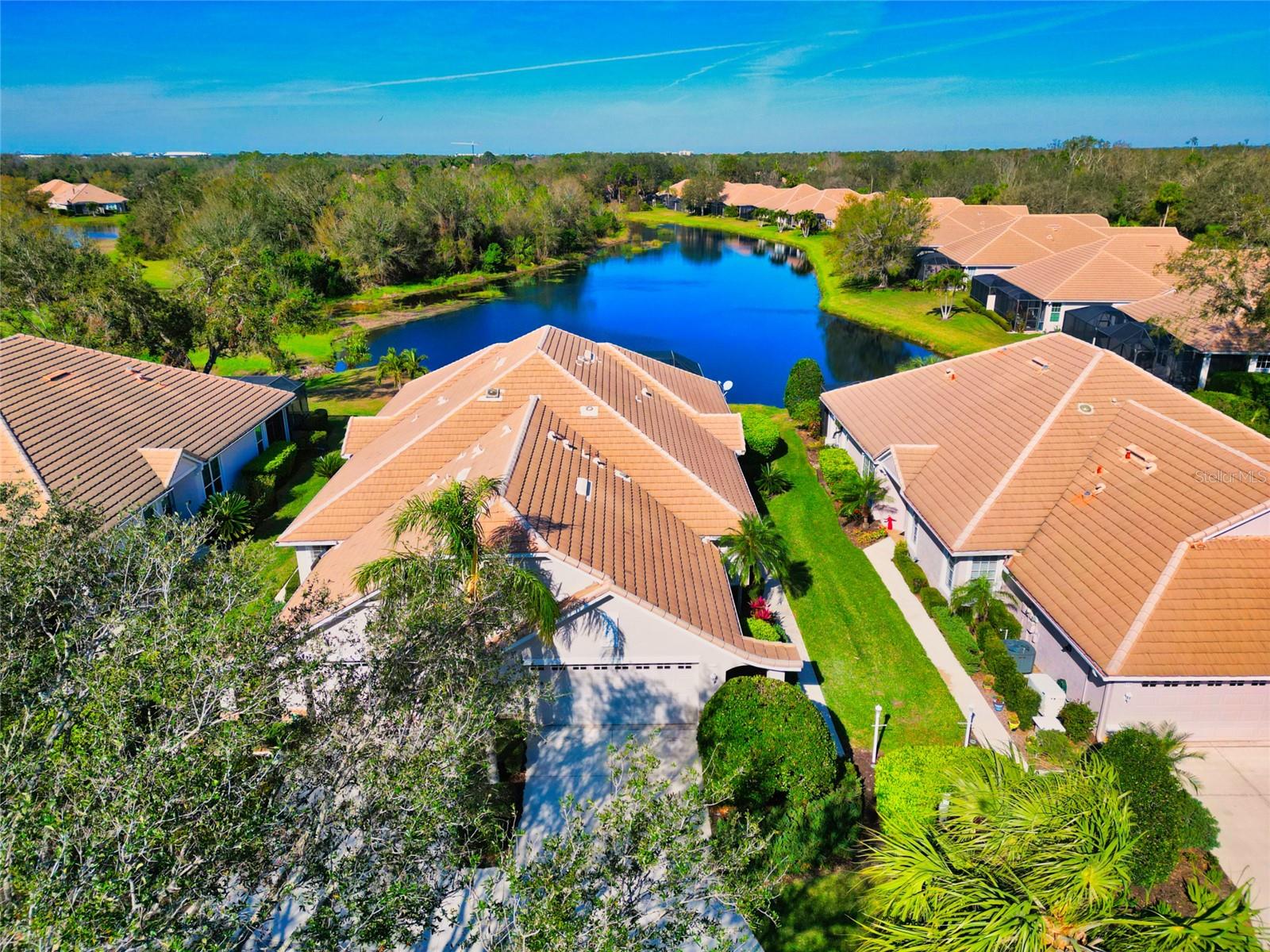 LAKEWOOD RANCH COUNTRY CLUB – PRIVATE POOL & WATER VIEW!
Experience the unparalleled lifestyle of Lakewood Ranch Country Club, where elegance meets resort-style living. Nestled within the secure gates of the Weston community, this spacious, move-in-ready villa offers breathtaking water views and a private pool, setting it apart from the rest.
Step inside to find a freshly painted interior with soaring ceilings, neutral tile floors, crown molding, and an open-concept layout designed for both comfort and sophistication. The gourmet kitchen boasts solid surface countertops, wood cabinetry, and stainless steel appliances—perfect for any home chef. The primary suite offers a peaceful retreat with serene water views, large closets, and a spa-like ensuite featuring a soaking tub and dual vanities. Two additional bedrooms and a second full bath provide ample space for guests or a home office.
Relax on the screened lanai, where you can soak in the tranquil scenery or take a dip in your private pool. Beyond your doorstep, enjoy access to three championship golf courses, tennis courts, a state-of-the-art fitness center, and two upscale clubhouses. Prefer something more laid-back? Stroll or bike along the scenic trails, or take a refreshing swim at the community pool.
Located just minutes from shopping, dining, and Main Street events, this home also offers easy access to Sarasota’s beautiful beaches, downtown, and the airport. Discover the perfect blend of luxury, privacy, and convenience in this exceptional Lakewood Ranch villa.
Make sure to click on the virtual tour button to check out the 3D tour of the home.