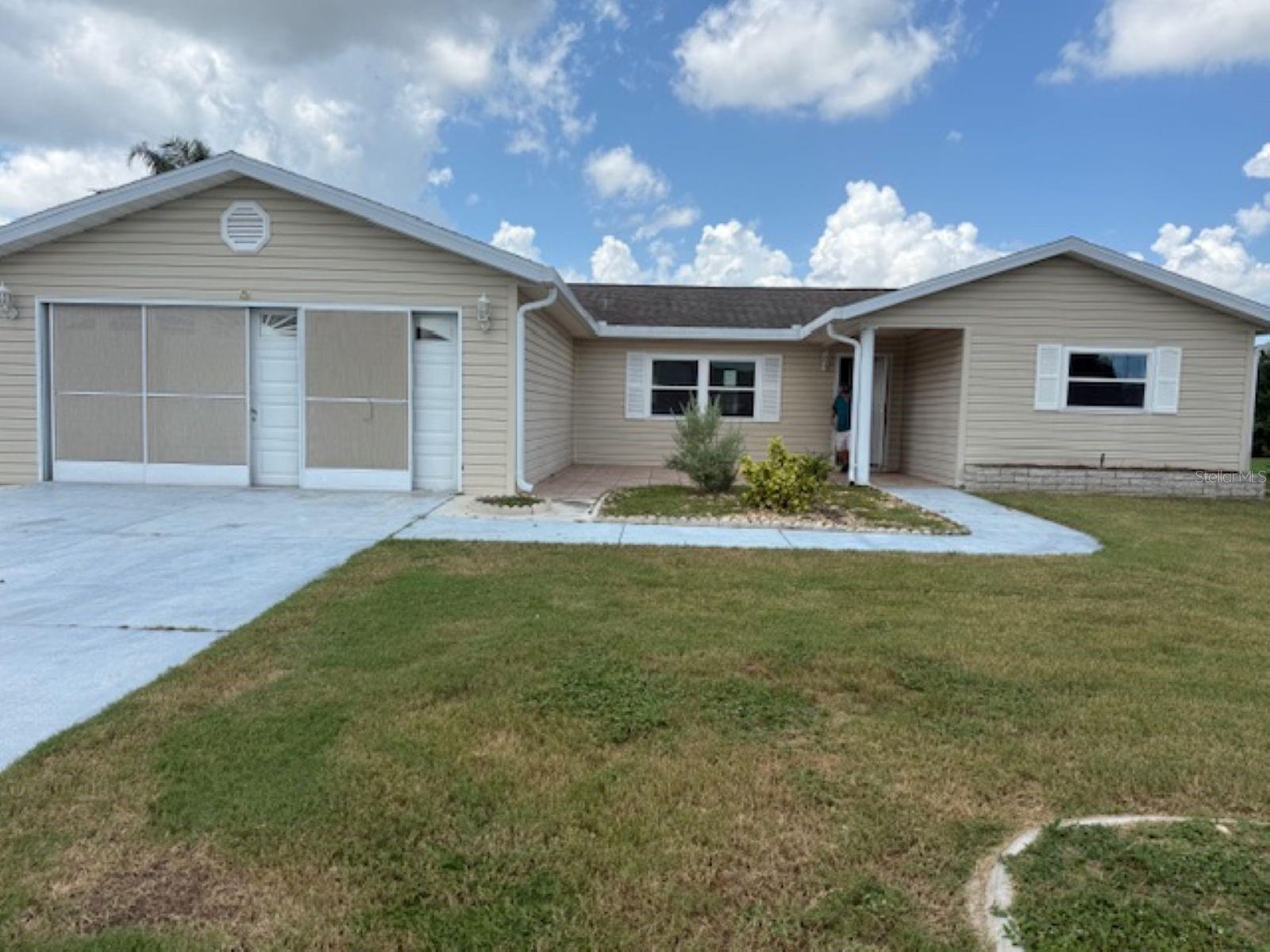 If you are looking for the perfect retirement paradise, you have found it in Spruce Creek South. This lovely, gated golf course community offers golf, pools and a host of clubhouse amenities at your fingertips. Located just minutes from The Villages, you have access to shopping and medical facilities nearby. This lovely 2bd/2ba home offers a gorgeous open floor plan with wood laminate flooring, a gormet kitchen with a plethora of cabinetry making this your dream come true. It even comes with its own Florida Room for you to enjoy the abundance of light just off the kitchen/dining area with 2 entrances! Don't wait this one is priced to sell!