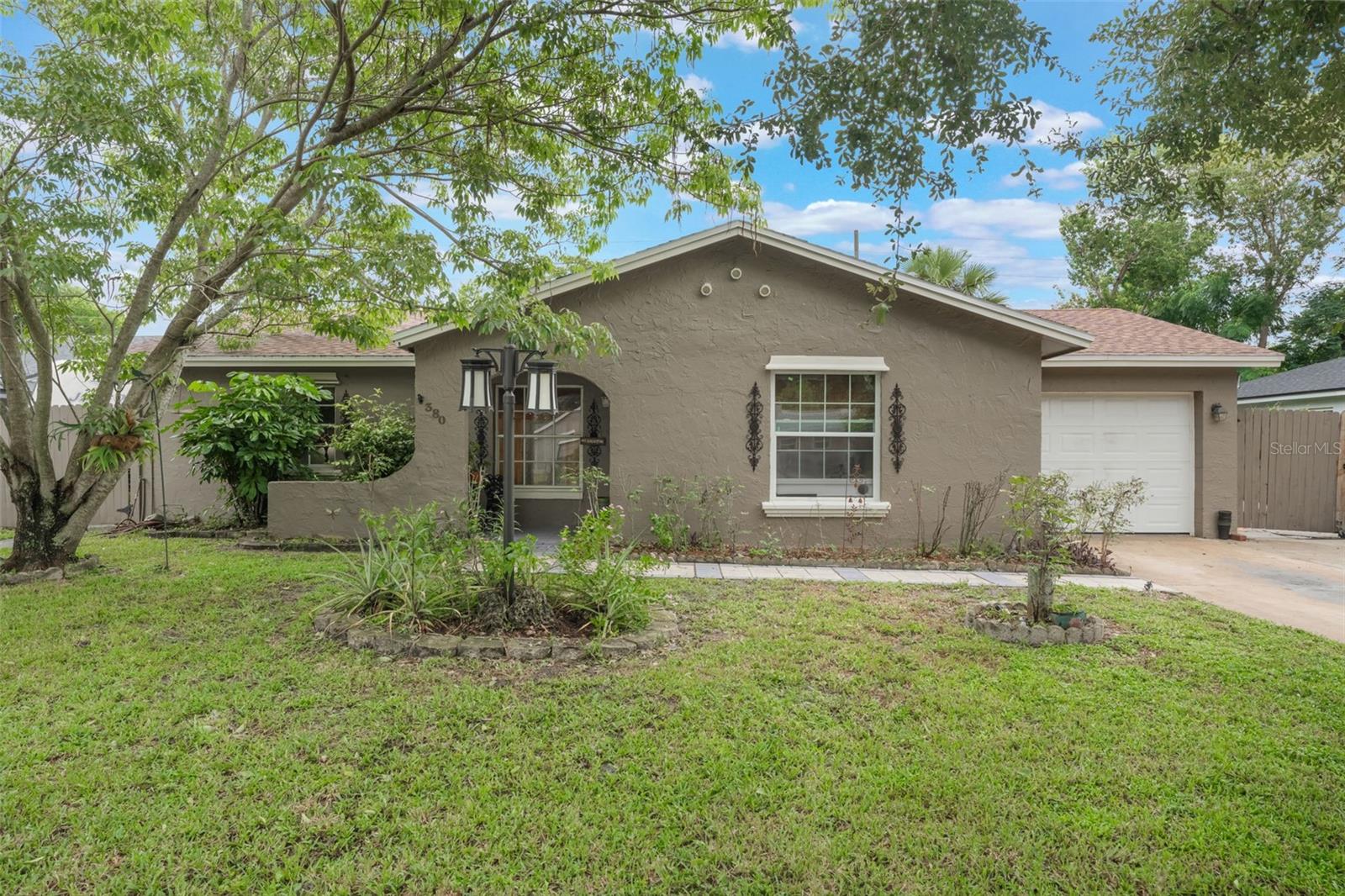 Your backyard paradise awaits! Discover this lovingly kept 3-bedroom, 2-bath pool home tucked away in a peaceful Casselberry neighborhood. Where you can enjoy lake access, stroll to Dew Drop Park, and live free from HOA restrictions. Designed for both daily comfort and entertaining, the open layout features a spacious living area that flows seamlessly into a well-appointed kitchen with a gas stove and generous storage. The split-bedroom floor plan offers privacy for the primary suite, complete with a walk-in closet and private bath, while two additional bedrooms and a second full bath provide versatile space for family, guests, or a home office.
Recent big-ticket updates bring peace of mind, including a new roof and electrical panel (2023), whole-home replumb (2020), and upgraded attic insulation (2025). Step outside and you’ll find your personal oasis—an in-ground pool, covered gazebo, mature landscaping, and a fully fenced yard ready for gatherings, playtime, or quiet evenings under the stars. With parks, schools, shopping, dining, and major roadways just minutes away, this move-in ready home delivers the perfect balance of location, lifestyle, and updates—all without the extra costs or rules of an HOA. Don’t miss your chance to make this house yours!