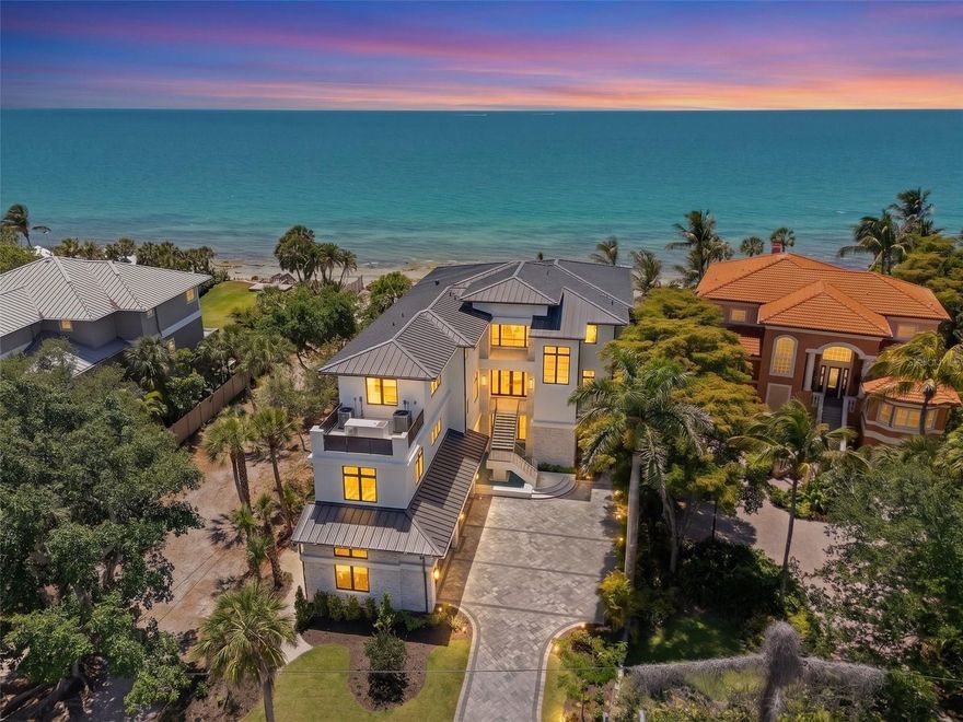 Newly completed Gulf-front coastal contemporary home on prestigious Siesta Key by Murray Homes. This 5BR/5BA/1HB residence offers approx. 5,500 sq. ft. of living space plus 2,600 sq. ft. of recreational non-conforming space.

Features include a gourmet kitchen with large island, walk-in pantry, wine refrigerator, and built-in coffee system, opening to a spacious great room with fireplace. Smart home technology, high-end lighting, and whole-house generator.

Outdoor living includes Gulf-front pool and spa with beach shelf, expansive deck, summer kitchen, fireplace, and lounge areas. Upstairs lounge with vaulted wood ceilings and beverage refrigerator, plus 4 en-suite bedrooms, many with Gulf views.

Primary suite with soaking tub, oversized shower, and dual vanities. Private beach on a secluded street with panoramic Gulf views. 4-car garage plus golf cart/kayak garage