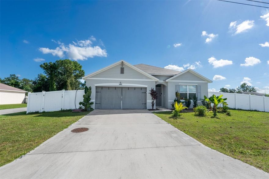 This is one of D.R. Horton's beautiful Cali models, open floor plan, with an open concept kitchen overlooking the living area, dining room, and outdoor lanai. This home is like new, built in 2023. It has been upgraded with interior lighting and hardwood flooring. There is also tile, and some carpet throughout the home. The space is amazing for entertaining. The spacious kitchen has upgraded backsplash, a lovely island, stainless steel appliances and great cabinetry.  This home has 4 bedrooms with the primary located off the living space, in the back of the home, for privacy. If you're looking for a move-in ready home that is available for a quick close, don't miss this opportunity. Contact the listing agent for a private tour.