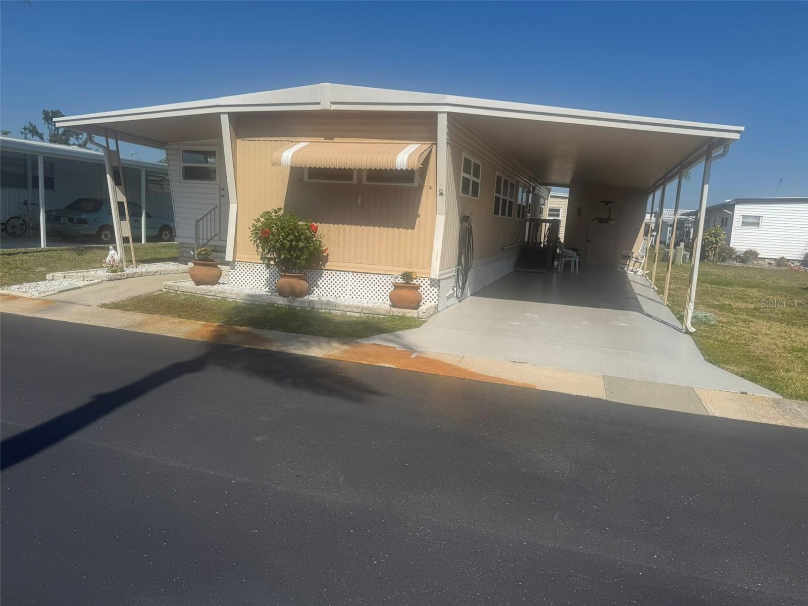 Cozy two bedroom unit in premier Pinellas County retirement community. Unit features an open floor plan with new flooring throughout. It also features a large kitchen/living room area great for entertaining. Kitchen has updated appliances and plenty of cabinet space. The main bedroom boasts plenty of storage space while the main bathroom features a tub shower combo. The second bedroom has an in-suite half bath and a large west facing windows great for viewing tropical sunsets. The home also has an extension that could easily be turned into a third bedroom. The unit includes a share of the cooperative association which gives owners a voice in community business. Located in Westwind Resident Owned community which includes amenities like year round temperature regulated pool, clubhouse with plenty of events, as well as an updated outdoor recreation area. Located minutes from shopping and entertainment, as well as beautiful Honeymoon Island. Low monthly fees include trash pickup and lawn service. You truly have to see it to appreciate it. Call for a visit today!