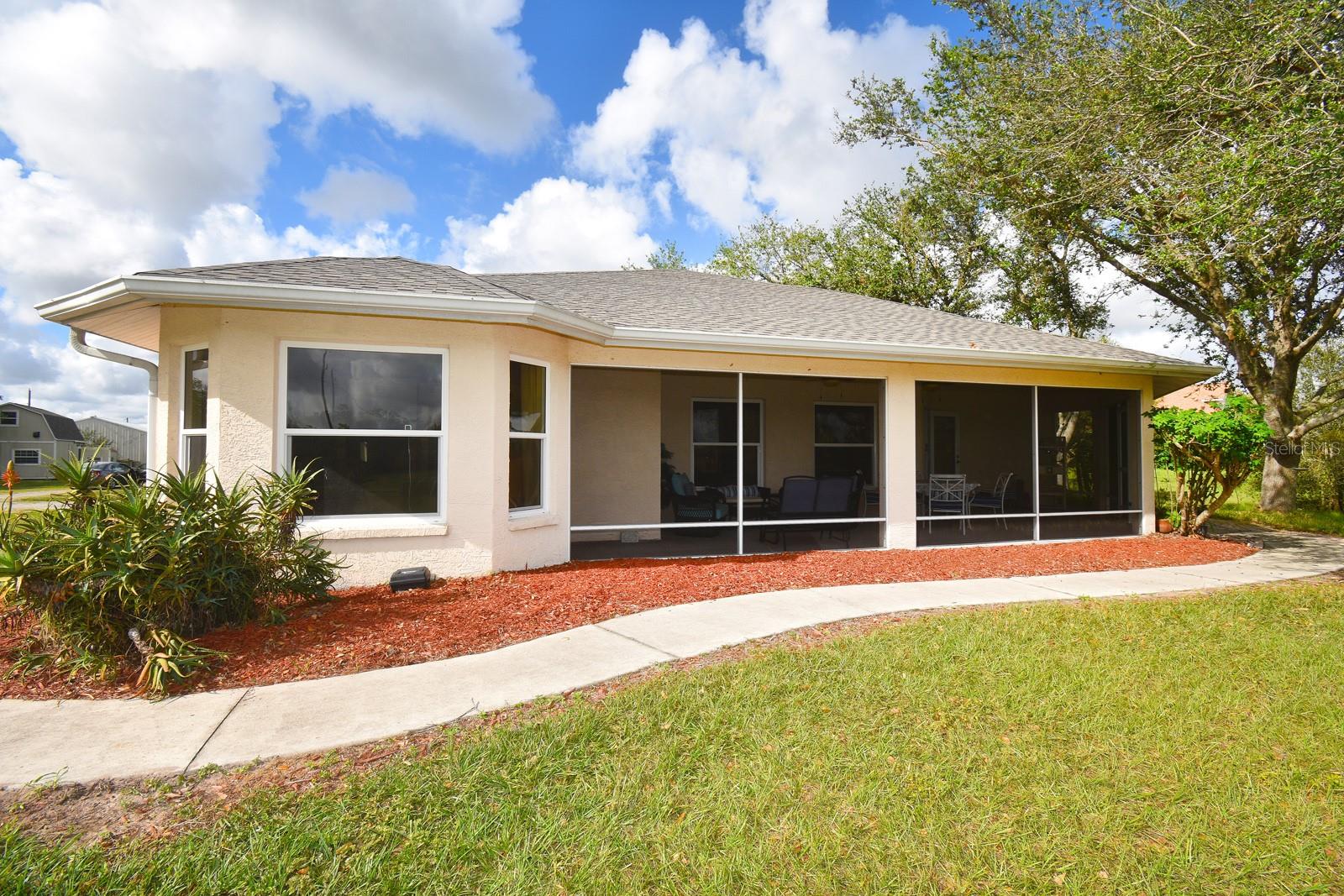PRICE REDUCTION with a $10,000 seller credit toward buyer’s closing costs.
Private Guest House / 5 Acres / 2 Ponds / Heated spa / 30x50 Barn / Chicken coop / RV Pad / No HOA or CDD.
This 5-acre estate offers country living zoned agricultural for horses, livestock, and RVs. The main home features 3 bedrooms, 2.5 baths, and a 2-car garage. Built in 2005, it has a new roof and a new AC unit. The split-bedroom floor plan includes three screened lanais, a gas fireplace, jetted tub, dual vanities, walk-in closets, and an indoor laundry / mud room with PGT impact-resistant windows and doors and ceiling fans throughout. The eat-in kitchen boasts newer appliances, a pantry, and a butler’s closet. The spacious master suite offers a serene bay window view of the front pond and pasture. Custom walk-in closet includes a stacked washer/dryer and built-ins. New laminate flooring installed in den, master bath/closet and new carpet in living room. An ~800 sq ft guest house includes 1 bedroom, 1 bathroom, and an upstairs flex space—perfect for guests or extended family. Outbuildings include a 30' x 50' metal barn with electricity, a loft, and concrete slab, plus a chicken coop with a water line, dog kennel, RV pad with hookups, two fenced pastures, and two scenic ponds. Additional features include a solar-powered gated entry, a ¼-acre fenced yard with a pet patio, transferable pest control and home warranty, and a location near TerraNova Equestrian Center, Myakka River State Park, I-75, and Sarasota beaches. Ideal for equestrian living, homesteading, multi-generational families, or recreational use.
