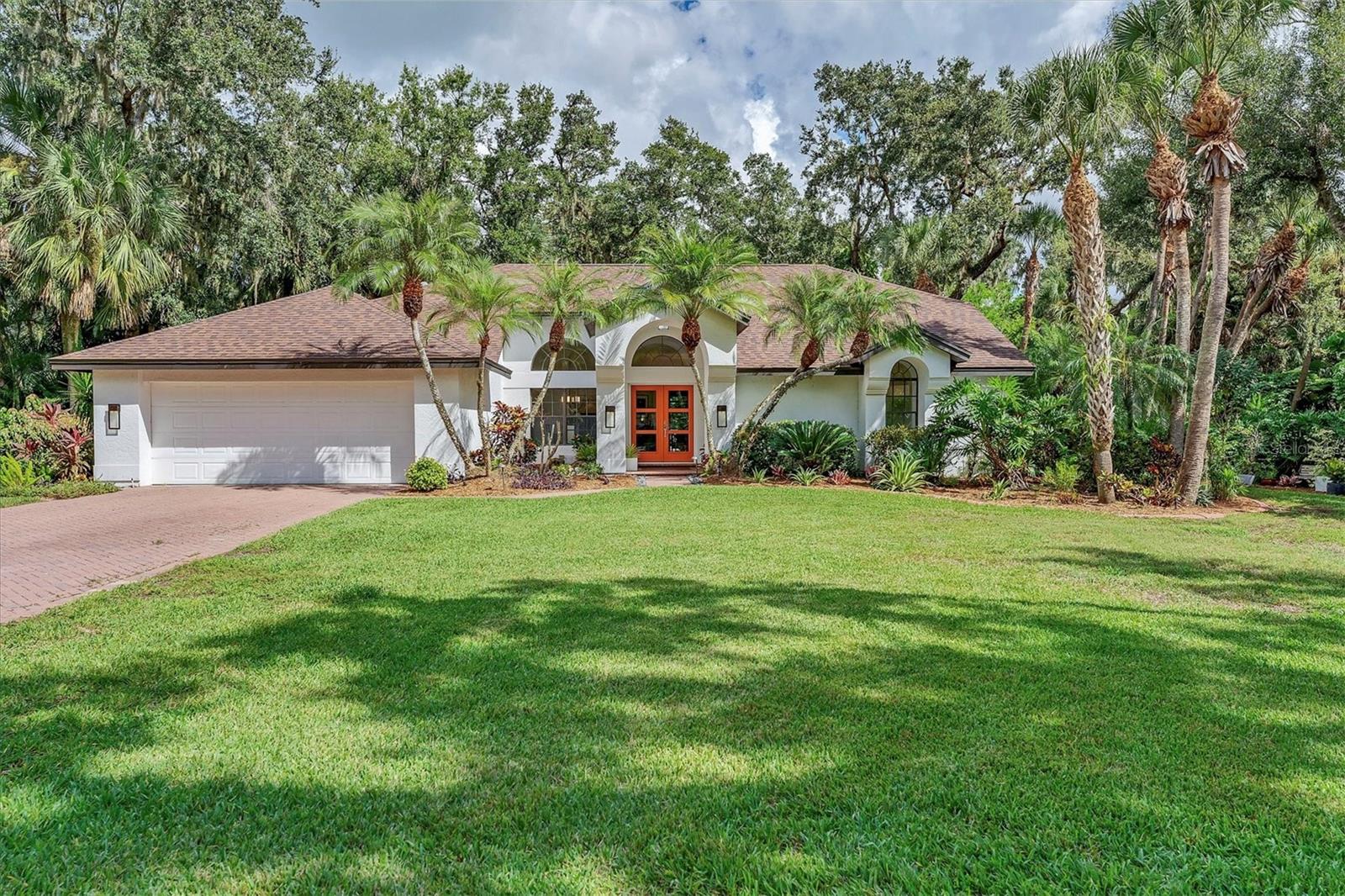 ENCHANTMENT IN MISTY CREEK – the opportunity for a “one in a million” property like this rarely comes on the market. Offering a lifestyle like that of a high-end resort and spa. Designed by a master gardener with ease of maintenance in mind, the backyard looks like something straight out of Selby Gardens. Nature lovers will enjoy seeing owls, deer, hawks, fish, and other wildlife daily. Orchids and a wide variety of flora, including some rare and collectible plants abound. The waterfall and pond can be observed and heard from vantage points throughout the home. Multiple “secret garden” spaces throughout the property give you the opportunity to reflect and simply enjoy nature. The outdoor lighting system is professionally designed to enhance the beauty of the property, especially the deck area in back that turns into your own private oasis. You're going to love the casual, contemporary design with mid-century elements. This 3-bedroom, 2-bath oversized 2-car garage pool home is nestled in The Preserve at Misty Creek. Set on .63 of an acre and tucked away within a CUL-DE-SAC at the coveted north end of Misty Creek, this home is, arguably, one of the best lots in all of Misty Creek and is in the X FLOOD ZONE, NO FLOOD INSURANCE REQUIRED. The main living areas and primary suite are light & bright. Pocket sliding glass doors open to the screened lanai & paver pool deck. There’s a covered seating area on the lanai that essentially brings the outdoors in and extends your living space. Seller improvements include a NEW ROOF (2021), NEW POOL CAGE (2018), POOL RESURFACING (2018), POOL HEATER (2018), NEW A/C (2017), NEW KITCHEN REMODEL, NEW BATHROOMS REMODEL, NEW APPLIANCES, NEW FRONT DOOR (2023), NEW OUTDOOR LIGHTING, NEW SLIDING GLASS DOORS & 9 NEW WINDOWS slated for installation in November 2025. High ceilings, crown molding, ceramic tile throughout the main living areas, and a laundry room that doubles as a butler’s pantry with additional cabinetry, sink, storage and countertop space all contribute to making this home not only beautiful, but functional. The Preserve at Misty Creek is a gated community of 302 single-family homes. It's an exciting time in Misty Creek as the Misty Creek Country Club is currently closed for renovations and the new improved club is expected to open in November 2025! Perks of Misty Creek – NO MANDATORY GOLF MEMBERSHIP, a well-run responsive HOA with LOW HOA FEES, “A” RATED SCHOOL DISTRICT with school bus stops within the community, a security gate, the feeling of being in the country with close proximity to everything you need, an established community with many longtime residents, the wildlife, nature & abundance of 100+ year old oak trees just to name a few. Misty Creek offers convenient access to shopping, beaches, parks, dining, I75, golfing, boating, fishing & more! Don’t miss your opportunity to have your own personal sanctuary in this beautiful community!!! SCHEDULE A SHOWING TODAY!!!