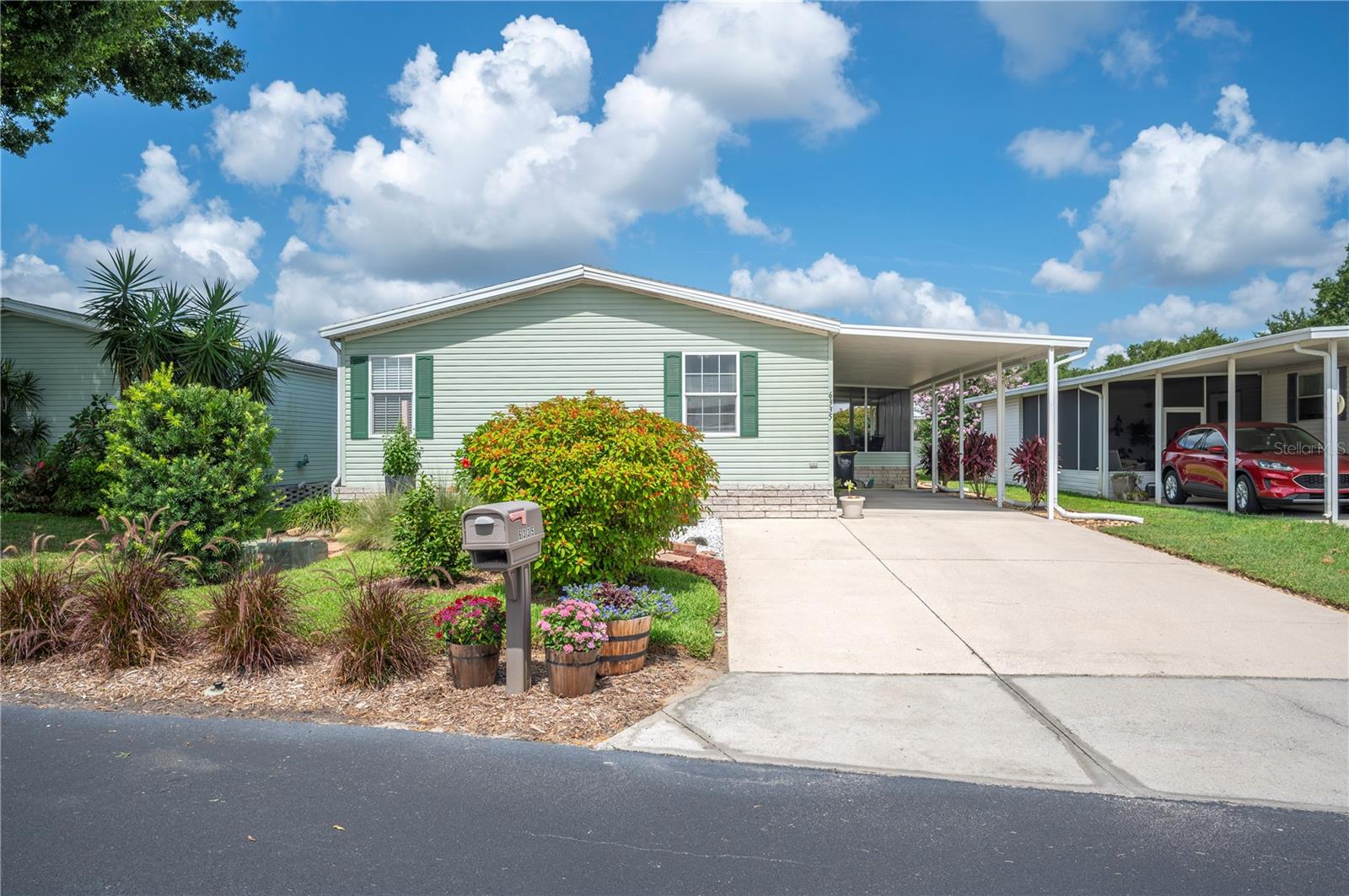 This 3 bed, 2 bath home located in The Garden Grove Oaks community is perfect for settling down and enjoying retirement. This features a large open floor plan upon entering the home, with a formal dining area and a breakfast area in the kitchen, split bedroom plan, an inside laundry area, and a large en-suite bath with a large tub highlighting some of the interior features. Outside the home, there is a large screened in patio, lush landscaping, attached storage shed, and a large carport. The Garden Grove Oaks community is a safe community and features a clubhouse, pool, and shuffleboard for each resident's enjoyment.