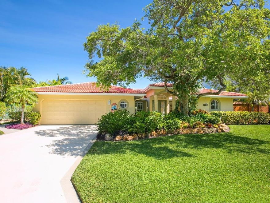 A peaceful drive along a canopy road leads to this remarkable waterfront Siesta Key Home.  This home is a great opportunity for water enthusiasts with no fixed bridges to the intra-coastal.  Entertain your guests in the generous gourmet kitchen, featuring wood cabinets, granite counters, breakfast bar and dining area. The stunning marble floors add to the casual elegance throughout this canal front home. Tray ceilings, built-ins and beautiful finishes make this home a true showpiece.  Extensive glass allows light and full view of the canal the lush tropical foliage that surrounds the house for added privacy.  Soak in the tropical sun, lounge under the covered lanai or swim in the sparkling pool, while enjoying the spectacular views.  This home is great for entertaining and offers some of the best water access Sarasota has to offer!  Just blocks to Siesta Key Beach, shops and restaurants of Siesta Key Village. Just minutes to the many amenities and cultural activities found in downtown Sarasota, this residence is perfectly located.