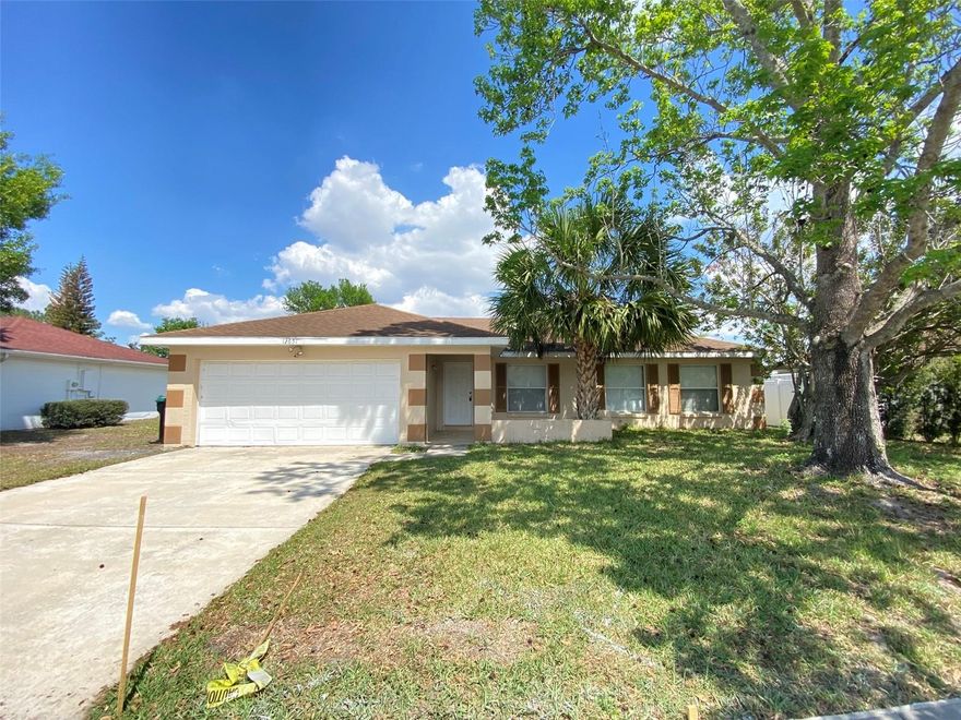 Spacious 4BR/2BA home with a 2 Car Garage.  Tiled Floors throughout.  Kitchen has eating space, lots of cabinets, sliding doors to the backyard. Large living room, spacious bedrooms. The primary bedroom has ensuite with shower. Split bedroom plan.  Large backyard with open patio. No immediate backyard neighbors. Owner has owned the home for 39 years.  Needs some updating.   Convenient location to shopping, restaurants, Medical City, Lake Nona, Orlando International Airport, Florida Mall, and 417.