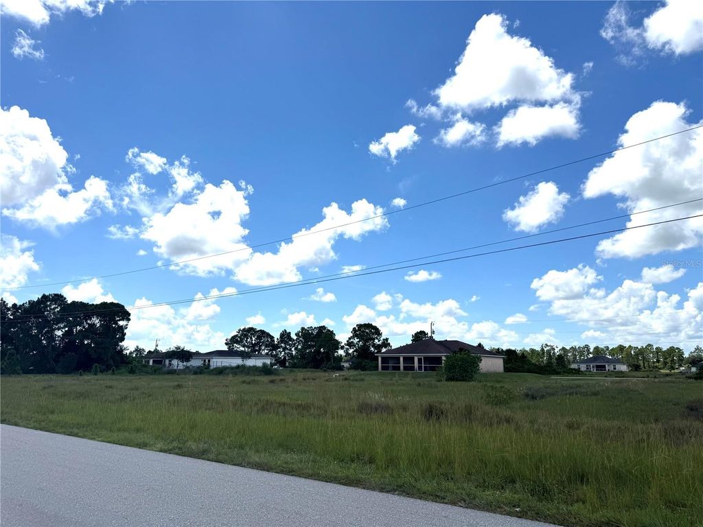 Photo of 834 Jaguar Boulevard, Lehigh Acres, FL 33974 (MLS # OM717693)
