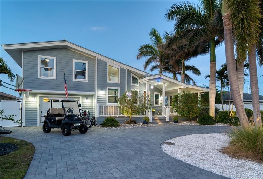 This is the mid-century modern waterfront home of your dreams! This stunning 3 bed, 3 full bath home on 1 and 1/2 lots just down the street from the beach has one of the best protected wide cove and intracoastal waterway views in Indian Rocks Beach. Completely rebuilt and renovated in 2013 by Brandon Construction, this show-stopping home allows worry-free waterfront living with impact-rated windows and doors, energy-efficient LED lighting throughout, a new metal roof in 2016, a Tesla charging station, and first-rate construction materials and finishes. Inside you will find the modern coastal decor you’ve been looking for, with dramatic 2-story floor-to-ceiling windows facing the water and tasteful finishes and design accents. As you enter through the gorgeous custom wood door hand-crafted by an Indian Rocks Beach artisan, you see straight through to the expansive water views. Watch dolphins and manatees from the large Timber Tech deck and expansive paver pool deck. This is truly a resort-style backyard with an immense L-shaped solar-heated saltwater pool with a large sun shelf, rock seawall fence, outdoor hot water shower, built-in fire pit, and plenty of additional yard to enjoy filled with large palms and mature landscaping. Perfect for outdoor entertaining with the large pool deck, two covered porches, plus the side wrap-around porch. There is a large composite dock with two boat lifts (12K and 10K), a floating kayak dock, two underwater fish lights, and a freshwater dock shower. The property is completely fenced and is dramatically lit at night with high-end landscape lighting. Inside you will find 3 bedrooms and 3 updated baths, two staircases leading to the two upstairs bedrooms, and a third-floor widow’s watch that allows stunning panoramic water views!