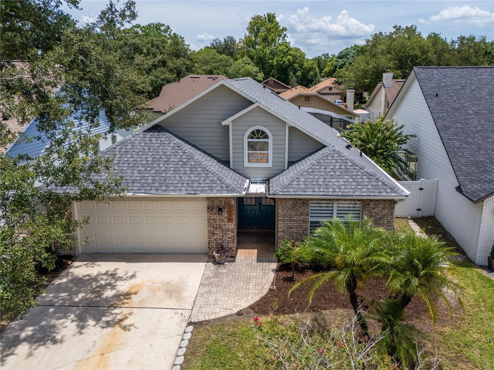 Welcome to this Show-Stopping Trophy Residence in the Coveted Community of Bryn Mawr. Discover refined living in this exquisitely renovated three-bedroom, two-bath pool home, perfectly situated in the prestigious Bryn Mawr neighborhood of Orlando. From the moment you arrive, you’ll notice the pride of ownership and thoughtful attention to detail, with a commanding presence that sets the tone for what awaits inside. Step through the front door and be greeted by an abundance of natural light, soaring ceilings, and 9” wide luxury vinyl plank flooring that flows seamlessly throughout the home. Elegant 5 ¼” baseboards, zebra blinds, and Bluetooth-enabled ceiling fans enhance the home’s modern sophistication. The open-concept living and entertaining space is designed to impress, featuring a custom wine cellar, generous gathering areas, and a chef-inspired kitchen that is both stunning and functional. Anchored by a quartz waterfall island, the kitchen showcases stainless steel appliances, a beverage fridge, pendant lighting, solid oak lower cabinets, white shaker uppers, and a designer backsplash. Gold-tone hardware, a pot filler over the stove, and a modern dining chandelier complete the upscale aesthetic. Retreat to the royal-worthy primary suite, where vaulted ceilings, a walk-in closet, and serene ambiance set the mood for relaxation. The spa-like ensuite bath is a masterpiece of design, featuring dual sinks with quartz counters, an expansive glass-enclosed shower clad in Spanish terrazzo-look tile, and equipped with dual rain showerheads and handheld sprays—perfectly crafted for a daily retreat. Two generously sized secondary bedrooms offer comfort and versatility, while the stylishly appointed guest bath features a quartz-topped vanity, chic gold fixtures, and a frameless glass shower with designer tile. Seamlessly transition from indoor to outdoor living through sliding glass doors to your private screened-in oasis, complete with a heated pool and spa, covered lanai, and a fully fenced yard ideal for entertaining or quiet relaxation. Additional highlights include a spacious laundry room with utility sink, solid wood interior doors, and automated dusk-to-dawn exterior lighting for added convenience. Key upgrades include a 2022 roof, 2022 A/C, and a newer water heater—offering peace of mind and move-in-ready luxury. Located in the highly sought-after Conway area, this residence places you minutes from Downtown Orlando, Orlando International Airport, and some of Central Florida’s best shopping, dining, and entertainment. Just moments away, the Conway Chain of Lakes offers pristine waters for boating, skiing, and fishing—a rare amenity for the lifestyle-driven buyer