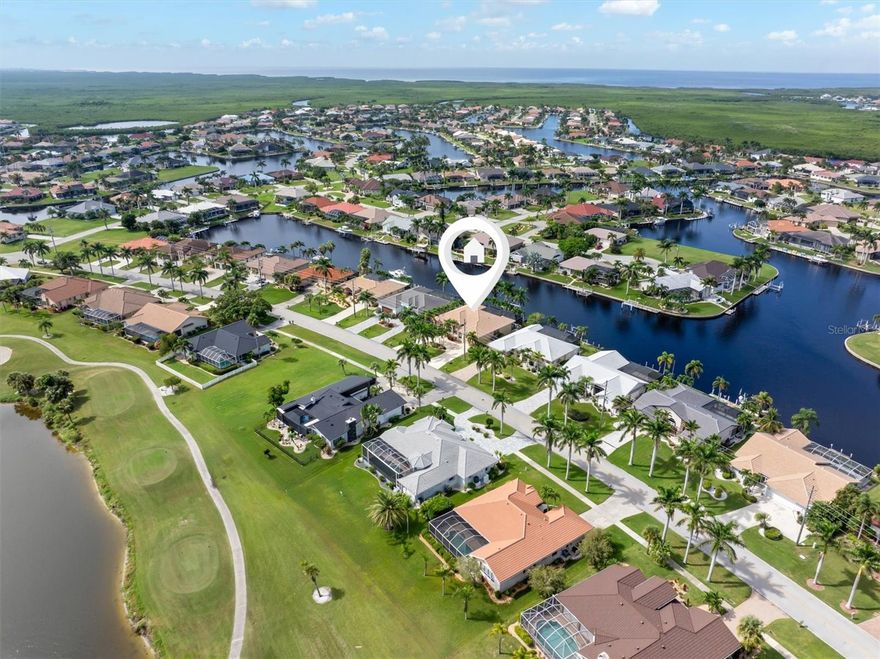 Waterfront living awaits in this beautifully maintained 3-bedroom plus office, 2-bath pool home with an oversized garage and more than 2,700 sq ft of living space in the highly sought-after community of Burnt Store Isles. Perfectly positioned on intersecting canals, this residence captures breathtaking water views, stunning sunsets, and lush tropical landscaping highlighted by stately Royal, Foxtail, and Christmas palms.

Designed for both elegance and comfort, the open split-bedroom floor plan features vaulted ceilings, skylights, and pocket sliders that seamlessly blend indoor and outdoor living. Recent updates include a new roof (2023), newer appliances, and fresh interior and exterior paint. A stamped concrete circular driveway provides ample parking and easy access, while the welcoming front porch with French doors and etched glass adds timeless curb appeal.

The oversized primary suite offers a private retreat with tray ceilings, dual walk-in closets, and a spa-inspired bath featuring dual vanities, a walk-in shower, soaking tub, and private water closet. Guest accommodations include two bedrooms and a shared bath with convenient pool access.
You’ll love spending time outdoors with a covered lanai, heated pool and spa, and a 45-ft concrete dock equipped with electric and water, plus a 10,000 lb boat lift providing direct access to Charlotte Harbor and the Gulf via Alligator Creek (sailboat water). For added peace of mind, the home includes electric roll-down, accordion, and panel shutters for full storm protection.


Ideally located near I-75, Punta Gorda Airport, historic downtown Punta Gorda, Fishermen’s Village, and the Yacht Club. Optional membership is available at Twin Isles Golf & Country Club, featuring an 18-hole championship golf course, tennis courts, swimming pool, and a vibrant clubhouse with indoor and outdoor dining plus numerous social activities. Nearby attractions include PicklePlex with 24 pickleball courts, fine dining, and boutique shopping. There’s always something happening—from international art exhibits to weekly farmers markets, music festivals, and holiday celebrations. It’s truly a lifestyle like no other.

Easy to show—schedule your appointment today and don’t miss the virtual and 3D tours!