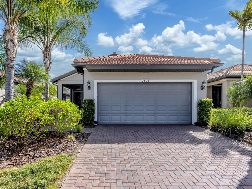 Welcome to this lovely, maintenance free single family home in the highly sought-after 55+ community of Cypress Falls at The Woodlands in North Port. Built in 2019, this meticulously maintained home offers an open-concept layout designed for both comfort and entertaining. The spacious chef’s kitchen is a true showstopper, featuring white shaker cabinets, abundant storage, leathered granite countertops, and a large cooking island that serves as the heart of the home.
The bedrooms have been updated with stylish new tile flooring, and the primary suite includes a spa-like ensuite bath and an oversized walk-in closet. Enjoy peaceful views from the extended lanai overlooking the lush preserve, with a tranquil water view just to the right. At the front of the home, the owners have added a charming screened-in porch — the perfect spot for morning coffee or a quiet evening retreat.
Cypress Falls is a beautifully maintained, gated, resort-style community offering an active, low-maintenance lifestyle. Residents enjoy a wealth of amenities, including a clubhouse with fitness center, two resort-style pools, a resistance pool, spa, tennis and pickleball courts, bocce ball, and scenic walking trails. With a full calendar of activities and clubs, Cypress Falls provides the perfect blend of relaxation and engagement in one of North Port’s most desirable 55+ neighborhoods.