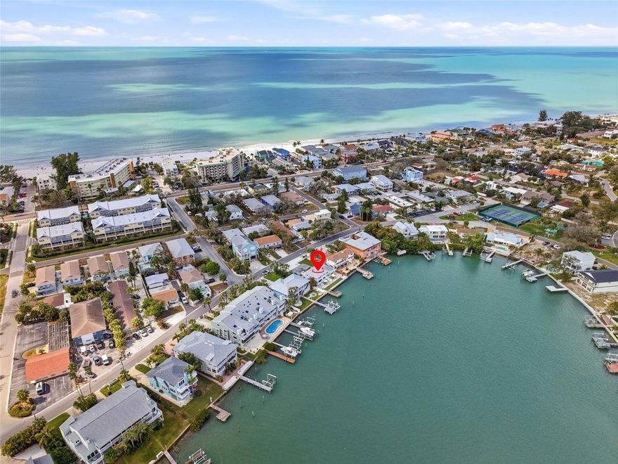 One or more photo(s) has been virtually staged. Experience the best of coastal living and investment potential with this beautifully updated waterfront triplex in the heart of Indian Rocks Beach. Perfectly positioned along the Intracoastal Waterway and just a short stroll to the Gulf, this property offers the rare opportunity to enjoy beachside living while generating income.
Each of the three residences features two bedrooms and one bathroom, thoughtfully designed with a bright, coastal aesthetic and modern finishes throughout. Updated kitchens, refreshed baths, and stylish flooring create inviting spaces that feel both comfortable and turnkey for guests or long-term occupants.
Start your mornings taking in peaceful water views from the rooftop deck as the sun rises over the Intracoastal, then spend the day at the beach just minutes away. Back at the property, the outdoor spaces are designed for relaxation and entertaining, featuring new pavers, a grilling area, dock access, and plenty of room to gather waterside. An outdoor shower makes rinsing off after sandy beach days effortless.
The property features 72 feet of new marine seawall, offering valuable waterfront protection and enhancing the long-term durability of this coastal investment.
Significant recent improvements provide peace of mind, including concrete block construction, hurricane impact windows, a newer roof, updated AC systems, new flooring and paint, granite countertops, exterior lighting, awnings, and low-maintenance tropical landscaping with irrigation. The property also includes three separate electric meters, dedicated storage areas with washer and dryer, carport parking, and dock access along the Intracoastal.
Offered fully furnished with keyless entry systems already in place, this property is ready to continue operating as a successful vacation rental, seasonal retreat, or multi-generational getaway. Live in one unit while the others generate income, or maximize its full investment potential.
Whether you’re searching for a waterfront lifestyle, a smart income property, or both, this Indian Rocks Beach triplex delivers a rare blend of location, updates, and versatility. *Financials will be provided at a later date*