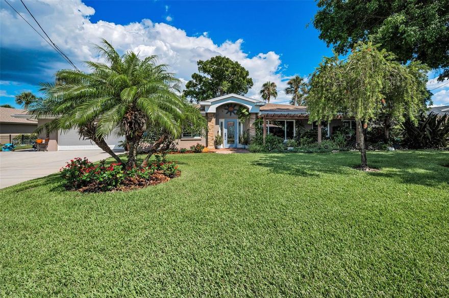 A hidden gem!  Paradise Found on Lake Tarpon! Prepare to be captivated by breathtaking lake views from nearly every room of this beautifully updated waterfront home. Nestled on the shores of Lake Tarpon, this 3-bedroom, 3-bath residence combines modern comfort with natural beauty—perfect for year-round resort-style living.  Step inside to an expansive great room, ideal for gatherings and panoramic lake gazing. Featuring engineered wood flooring, a Chicago brick fireplace, wood-look ceiling, and elegant crown molding, this room is both warm and spacious. The formal dining area boasts picturesque views of the screened pool and the sparkling lake beyond—an ideal setting for hosting family and friends. The spectacular kitchen, updated in 2022, showcases shaker-style cabinetry, a custom range hood, premium leather-finished granite countertops, GE Café matte appliances, and a cozy breakfast nook overlooking the water. A built-in desk area offers inspiring lake views as you work or plan your day. The owners’ suite is a private retreat, complete with serene water views to greet you each morning. The spa-like master bath, fully remodeled in 2020, includes cherry cabinetry, stacked stone accents, Blue Pearl granite, a soaking tub with tub filler, and a luxurious walk-in shower with rain showerhead and handheld . Enjoy peace of mind with wood-cased impact windows and doors, and relax by the heated, screened-in pool surrounded by a large pavered deck—perfect for lounging. After a swim, head down to your expansive dock, which features a sundeck, covered lounge area, and  boat lift (currently holding a jet ski but prior owner had the lift for a boat). Take a short cruise across the lake to the Tarpon Turtle for lunch or dinner. Notable Upgrades & Features: water heater with recharge system 2024, kitchen 2022, exterior paint 2022, master bath 2020, secondary baths 2022 and 2016, both A/C s in 2018, roof 2016 and pool salt system  2024, no carpet (wood and tile floors), plantation shutters, custom blinds, pavered walkways, epoxy garage flooring, extra parking pad, fenced lot, sprinkler on lake water, and meticulous attention to detail in updating.   Located minutes from golf courses, shopping, and the Gulf beaches, this home is part of a rare lifestyle. Lake Tarpon, the largest lake in the county, is perfect for fishing, boating, skiing, and lakeside dining. Wildlife lovers will delight in daily sightings of eagles, ospreys, herons, and the occasional playful otter. Low-cost flood insurance ($1,200/year) with monitored lake levels (continuous lake levels maintained by authorities) for added assurance. Welcome to Lake Tarpon living at its finest!