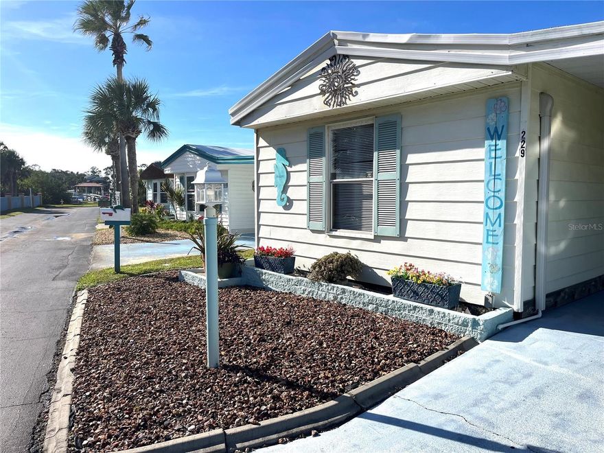 If you are looking for a winter get-away or full time residence at the beach this might be the one for you! This cute, cozy home is so bright and airy and it has had some recent updates; Mitsubishi Mini Split A/C units (4) installed in 2019, new roof in 2022, and new kitchen with all new stainless steel appliance, granite counters, soft close cabinets and luxury plank flooring in kitchen and living room in 2023. New stack washer/dryer, beautiful walk in shower and toilets also in 2023. Open floor plan with split bedrooms for extra privacy for your guests. It also has a large Florida Room that is heated and cooled giving you extra square footage for entertaining. Located in Surfside Estates, an active 55+ Manufactured Home Community that is nestled between the Atlantic Ocean and the Intracoastal Waterway. Surfside Estates is a Resident Owned land share Community which means there is no lot rent! When you purchase your home in Surfside Estates you own a share of this beautiful beachside community. The monthly maintenance fee is $220/month and includes wi-fi, internet, cable, yard maintenance, management and use of all the facilities. There is an inground heated/cooled pool, fitness room, library, shuffleboard court and rooftop deck. The Social Club offers many activities to get involved as much or as little as you like. Friday night bingo, men's and lady's cards, pool tables and large screen TV for all your sporting events. Exercise classes and water aerobics. Walk to the beach across the street or ride your bike or golf cart to one of the 2 docks to enjoy fishing or just relax and enjoy the sunsets and the boats and dolphins go by. There is kayak storage, a BBQ Pit and gazebo with a view of the Intracoastal. The quaint neighboring town of Flagler Beach is just a few minutes down the road, where you will find a variety of shops and restaurants to choose from. Just over the bridge you will find shopping, restaurants, hospitals and doctors. What are you waiting for? Time to get out of the cold and start enjoying your own piece a paradise today!
