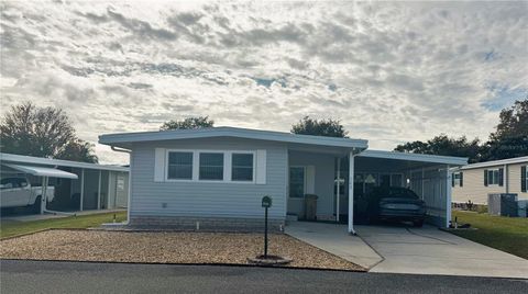 Photo of 143 Jacaranda Drive, Leesburg, FL 34748 (MLS # R4910427)