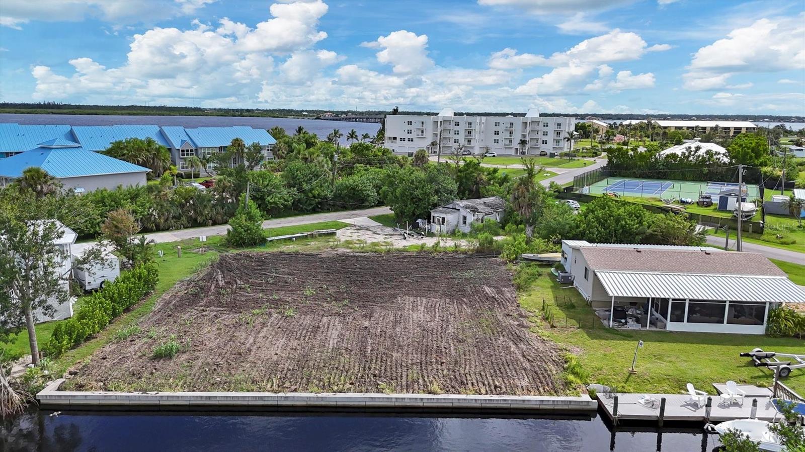 Unparalleled Gulf Access—No Bridges, No Limits!
This exceptional cleared waterfront lot features 100 feet of seawall on sailboat water, just 1,500 feet from Charlotte Harbor with full-speed access to the Gulf of Mexico—no bridges, no slow zones. Perfect for the avid boater or luxury home builder, this property is ready for your dream build. Pre-approved home plans by the county are available upon request, and the site can accommodate one or two homes, offering excellent investment potential. We can connect you with top-tier builders and designers to create a custom masterpiece. Located in the heart of Southwest Florida, you’re just minutes from Port Charlotte, North Port, and Englewood’s world-class beaches, fine dining, boutique shopping, and more. Here, every sunset is an event, and every day is paradise.