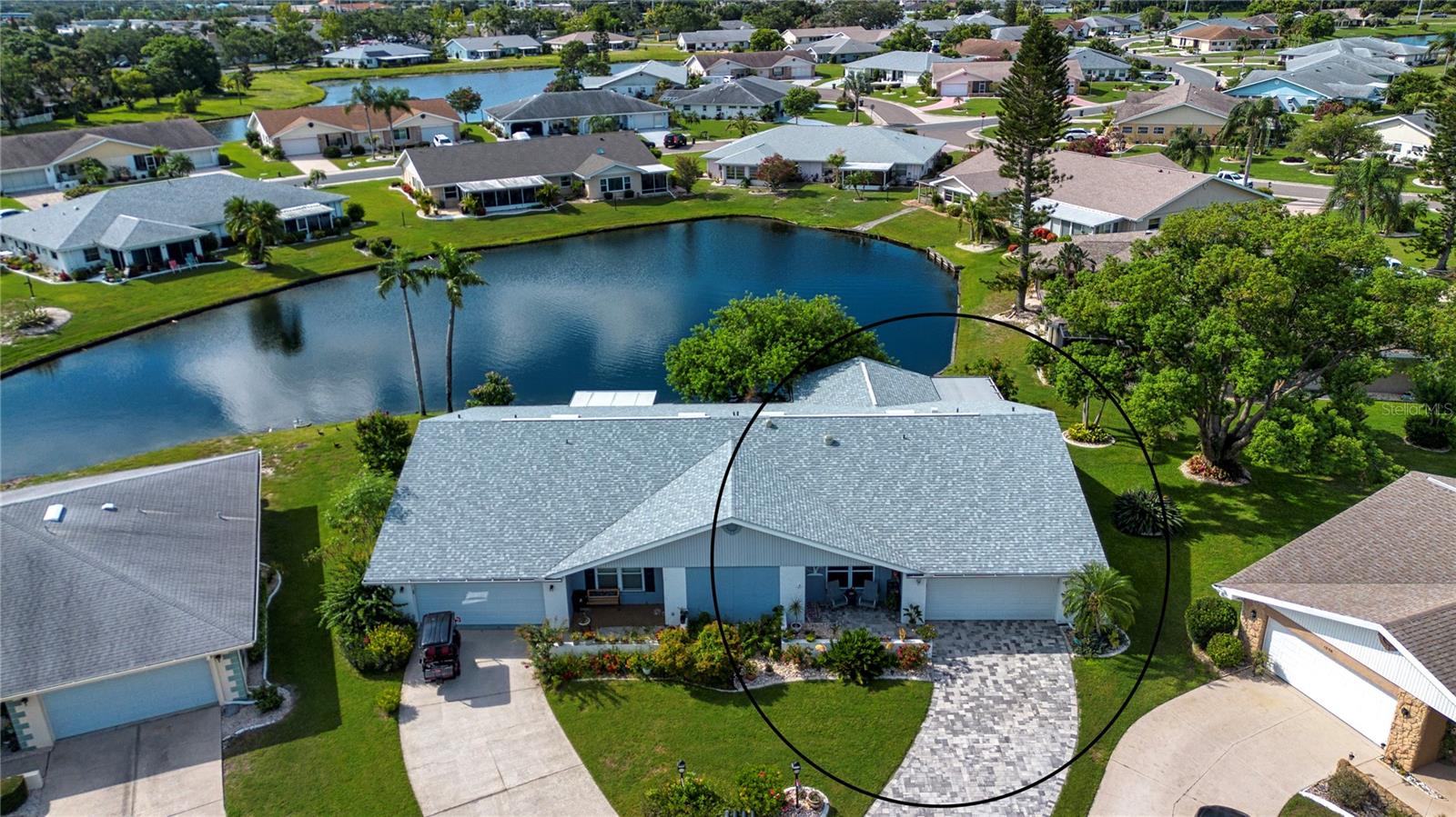 When you visit this home you will feel like you have stepped into paradise! This immaculately maintained twin tree model is located in the heart of Sun City Center on a quiet cul de sac with water access and amazing water views! There is a cozy front porch with front yard gardens. The living and dining areas feature new waterproof vinyl planked flooring and new baseboards. This living area is very large and features natural lighting and new ceiling fans. The large living room can also be divided and used as a small den or computer area.
The open kitchen features stone countertops, all new LED lighting, lots of cabinet space, all newer appliances . This very efficient kitchen allows you to enjoy a breakfast bar and looks into the spacious family room. From here you can enter your inside lanai which is under air and complete with sliders to the outside. The view from both your inside and an outside lanais is absolutely beautiful. Here you will find amazing plantings, shade from a lovely tree and a relaxing place to just enjoy nature, or fish in the lake! The landscaping is very nicely done and provides privacy. Your master suite is complete with an en suite bath which has been completely remodeled in 2025. You have a beautiful view from this master bedroom window. Your guests will enjoy a very private guestroom with an adjacent full bath with a new shower. There are pretty views from this room also. On top of all this, you will enjoy a spacious inside laundry room, with a full pantry and access to your two car garage which has a new garage door opener. The home also features a new sealed paver drive and a new roof complete with the third nail for additional safety. There is also a rubber roof installed over the screened back lanai so you can enjoy watching the rain in comfort! You water your yard from the lake so this saves you on your water bill. From top to bottom this home provides all the comforts that our wonderful Florida lifestyle has to offer! Call today for your private tour!