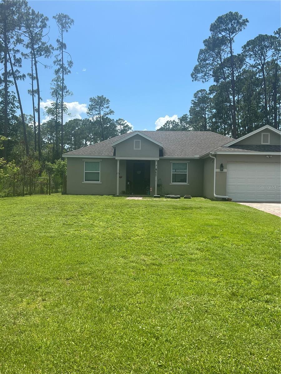 SELLERS MOTIVATED! This home will impress your pickiest Buyers. Beautiful open floor plan with new lighting, 72” ceiling fan, ceramic tile grout has been restored, vaulted ceilings, large closet pantry, new island with butcher block, lovely granite counters. Owner installed a new septic tank overflow valve, and had the septic tank pumped out. There is a leased whole house water filtration system along with a leased security alarm, the Buyers can continue if desired. New outdoor lighting and security cameras, paver driveway and walkway. Interior doors are 8’ tall and beautiful! Primary bedroom has a nice tray ceiling, walk-in closet and luxury vinyl flooring in all bedrooms. The primary bathroom has dual sinks, granite counters, shower with rain shower, water closet and vanity space. Living area has sliding doors out to a covered patio with paver flooring. Large lot with ample space for parking recreational vehicles, boats, etc.