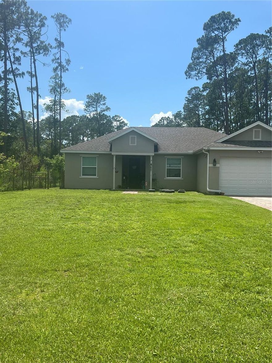 SELLERS MOTIVATED! This home will impress your pickiest Buyers. Beautiful open floor plan with new lighting, 72” ceiling fan, ceramic tile grout has been restored, vaulted ceilings, large closet pantry, new island with butcher block, lovely granite counters. Owner installed a new septic tank overflow valve, and had the septic tank pumped out. There is a leased whole house water filtration system along with a leased security alarm, the Buyers can continue if desired. New outdoor lighting and security cameras, paver driveway and walkway. Interior doors are 8’ tall and beautiful! Primary bedroom has a nice tray ceiling, walk-in closet and luxury vinyl flooring in all bedrooms. The primary bathroom has dual sinks, granite counters, shower with rain shower, water closet and vanity space. Living area has sliding doors out to a covered patio with paver flooring. Large lot with ample space for parking recreational vehicles, boats, etc.