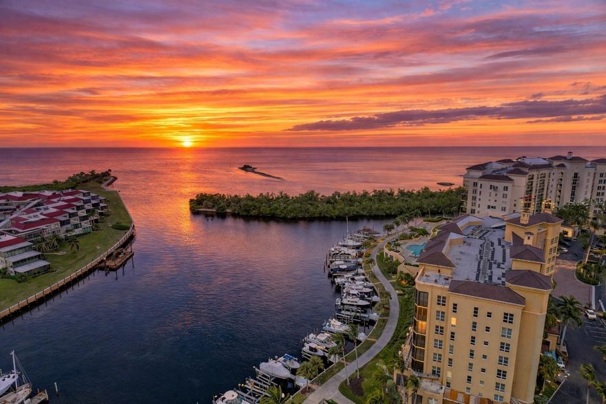 Live the Grande Isle lifestyle at Burnt Store Marina, where every day comes with Charlotte Harbor views, glowing sunsets, and a true waterfront resort vibe.

Step inside this popular Wedge floorplan (over 2,000 sq. ft.) and you’ll immediately feel the light, openness, and coastal energy. A tray-ceiling double foyer leads into the spacious great room featuring 9’4” ceilings and wall-to-wall sliders that bring the outdoors in. Open them up and head out to the 20' x 9' screened lanai—the perfect spot for morning coffee, evening cocktails, and front-row views of the harbor and channel.

This 5th-floor, 3 bedroom / 3 bath residence includes two suites and delivers the kind of panoramic water views buyers dream about—watch sailboats drift by, enjoy the sparkling water all day, and soak in those breathtaking Punta Gorda sunsets right from home.

The kitchen is both warm and functional with wood cabinetry, granite countertops, all newer stainless appliances and a breakfast bar made for casual gatherings. Nearby, a serving bar with a wine chiller adds an extra touch of fun—ideal for entertaining or setting up an easy coffee and cocktail station.

The primary suite opens to the lanai, so you can wake up to the sunrise and feel the coastal breeze. The ensuite bath offers a relaxing soaking tub, glass-enclosed shower, dual vanities, and generous storage with both a walk-in and linen closet. Bedroom two is a private guest suite with its own full bath—great for visitors. Bedroom three works beautifully as a guest room or home office and features a glass-door entry for added style.

Grande Isle residents enjoy a private, upscale amenity package including a resort pool & spa, clubhouse with catering kitchen, theater room, and a 24-hour fitness center with sauna and steam rooms. There’s also covered parking, grilling areas, and climate-controlled storage—all inside a secure, gated setting.

And outside your doors? Burnt Store Marina & Country Club offers the Platinum Point Yacht Club, 27-hole golf course, tennis & pickleball, Freedom Boat Club access, and popular waterfront dining at Cass Cay. Spend the evening on the Ship’s Store deck with harbor breezes—and don’t be surprised when dolphins or manatees show up.

Come experience Grande Isle—waterfront living at its best.