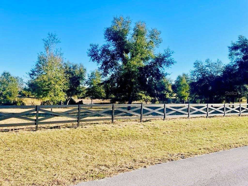 Photo of Hunters Trace Lane, Clermont, FL 34715 (MLS # TB8460650)