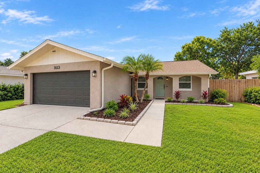 Photo of 1613 Greenwood Drive, Dunedin, FL 34698 (MLS # TB8555784)