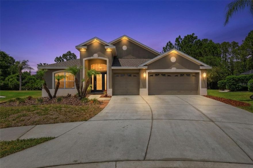 LOCATION: Wesley Chapel. LOCATION: Peaceful cul de sac. LOCATION: Lush conservation backdrop. Welcome to Inland Homes' well
appointed Devonshire where this generous lot can be more peaceful than a nature preserve on the cozy lanai or festive with events organized by the clubhouse or neighbors. Birds chirp, squirrels chitter, trash pandas play, and the occasional lowing of a beefy bovine can be heard from the screened lanai that looks directly into a sea of waving grasses and jungle wilderness. Staying outside, the new roof from 2025 will keep you dry and the landscaping has been cleared for easy maintenance, but it could be an exceptional blank canvas for your own artful design ideas.  On the inside, you’ll find high vaulted ceilings, new plank flooring, and ample open space for entertaining. Offering double primary bedrooms, this 4-bedroom home with a spacious front office also features three full bathrooms and a very versatile 3 car garage. The spacious Grand primary suite boasts double sinks, a jacuzzi brand soaker tub, a private toilet, and a large walk-in closet while the Junior primary has a thoughtful Jack & Jill bath that leads to the lanai for easy access or in case a private pool is ever a consideration.  This well-loved home is move-in ready but could use your decorating ideas and some updates to make it your very own peaceful slice of Wesley Chapel in the Nesslewood Neighborhood of Meadow Pointe III.