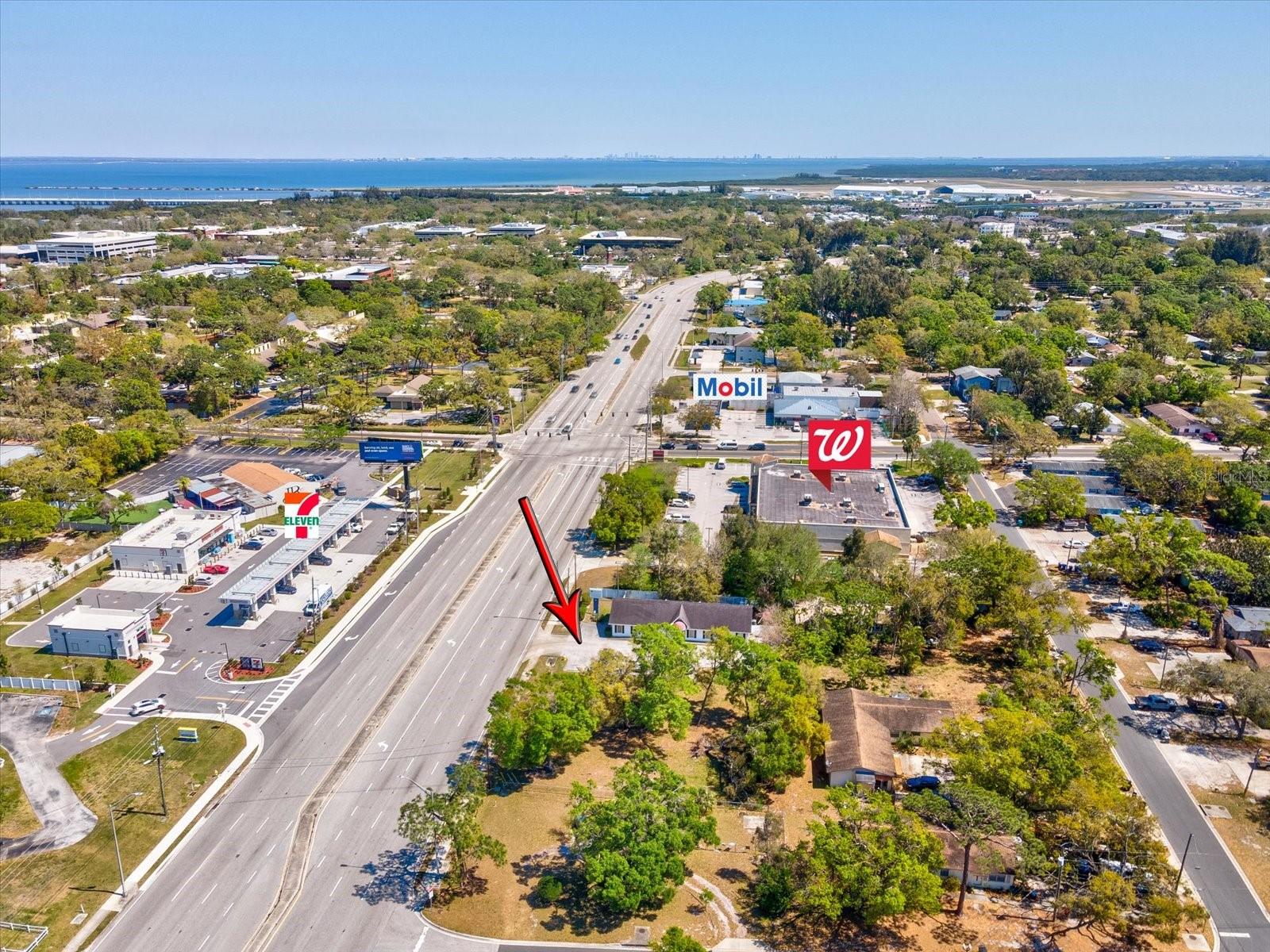 Prime Opportunity on Roosevelt Boulevard! Seize this rare chance to own nearly ¾ acre of prime real estate in a high-visibility location. This unique property consists of three parcels with five lots on the corner of Roosevelt and 59th Street N. Located next door to Walgreens and across the street from the brand new 7-11, this property features: A 2,340 sq. ft. Office building, a vacant lot ready for development and an 800 sq. ft. cabin currently in use as a residential home. Current zoning is Residential/Office but could possibly be rezoned. Perfect for owner-occupant, investor, or redevelopment. This centrally located property offers excellent access to St. Pete-Clearwater Airport—literally down the street! Close to Tampa International Airport, I-275, US Highway 19 and approximately 20 minutes to the Gulf beaches. Don't miss out on this exceptional opportunity in a thriving commercial corridor.