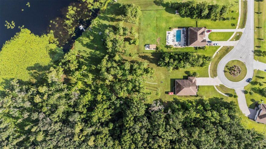 Discover a ONE-OF-A-KIND LAKEFRONT retreat at 17804 Waterway Creek Drive—a beautifully designed 3-bedroom, 2.5-bath Meritage Home built in 2018. Set at the end of a quiet CUL-DE-SAC inside a GATED community, this rare property spans 2.64 ACRES with direct access to Lake Stemper, a 115-acre SKI LAKE known for its SUNSET VIEWS and year-round recreation.

Inside, you’ll find 2,547 sq. ft. of open living space, highlighted by 10-FOOT CEILINGS and abundant natural light. The gourmet kitchen anchors the main level with stainless steel appliances, a large island, a supersized walk-in pantry, and quartz countertops —ideal for everyday living and hosting. The living and dining areas connect seamlessly, creating an easy, comfortable flow.

The primary suite is thoughtfully situated to take in the lake views and includes a spa-style bathroom with a large WALK-IN SHOWER, SOAKING TUB, DUAL VANITIES, and an expansive walk-in closet. The home also offers two attic spaces—one accessible directly from the primary closet and the other from the garage. A generous flex room provides versatility for a home office, gym, or possible fourth bedroom.

Step outside to enjoy true Florida living: a floating dock, screened back patio, above-ground spa, and beautifully landscaped grounds, all backed by peaceful conservation. Whether you’re boating, fishing, or unwinding by the water, this outdoor space is designed for both relaxation and fun.

Additional practical features include hurricane shutters, gutters, irrigation, a private well and septic system, a high-efficiency air-filtration HVAC system and UV-blocking double-pane windows.

And the location is just as impressive—10 minutes to STARBUCKS, 20 minutes to TAMPA PREMIUM OUTLETS for shopping and dining, and 30 minutes to TAMPA INTERNATIONAL AIRPORT, offering easy access while still maintaining the privacy of a natural retreat.

It’s rare to find a home that delivers land, waterfront living, and convenience all in one place—this is a standout property you won’t easily find again.