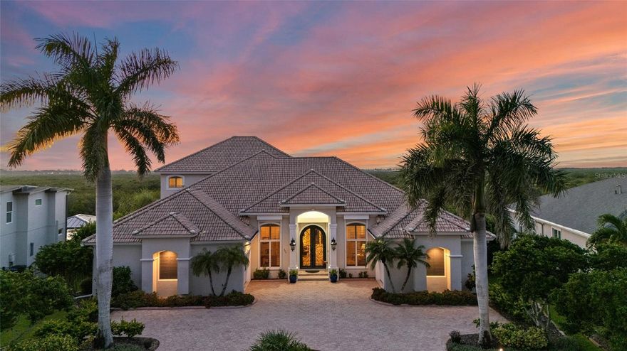 Serene Waterfront Luxury with Stunning Sunsets!  Welcome to your dream home in New Smyrna where luxury meets comfort and every day feels like a vacation. A wide circular driveway brings you to a stunning entry with double doors and a custom ceiling mural that sets the tone for this elegant home.  Inside, there’s room for everything you need: a private office with built-ins, a cozy library, and a gourmet kitchen made for entertaining with granite counters, big island, double ovens, two dishwashers, walk-in pantry, and even a mural aquarium overlooking the pool area and mangroves.  The main suite is your personal retreat with peaceful views, French doors to the pool, tray ceiling with mural, two walk-in closets, and a spa-like bath with dual sinks and a huge shower. A second full suite on the first floor is perfect for guests or in-laws. Upstairs, a loft with water views, kitchenette, and more guest suites gives everyone their own space. Step onto the balcony to take in the sunsets — they’re simply unforgettable.  Outside, enjoy your own screened oasis with pool, spa, summer kitchen, and convenient pool bath. Extras include a new boat lift, 22KW generator, 3-zone A/C, Anderson impact windows and doors, crown molding, shutters, central vacuum, and surround sound.  From boating and fishing to kayaking or watching dolphins and manatees, this backyard is all about Florida living at its best. No HOA and short-term rentals allowed make this a rare opportunity.