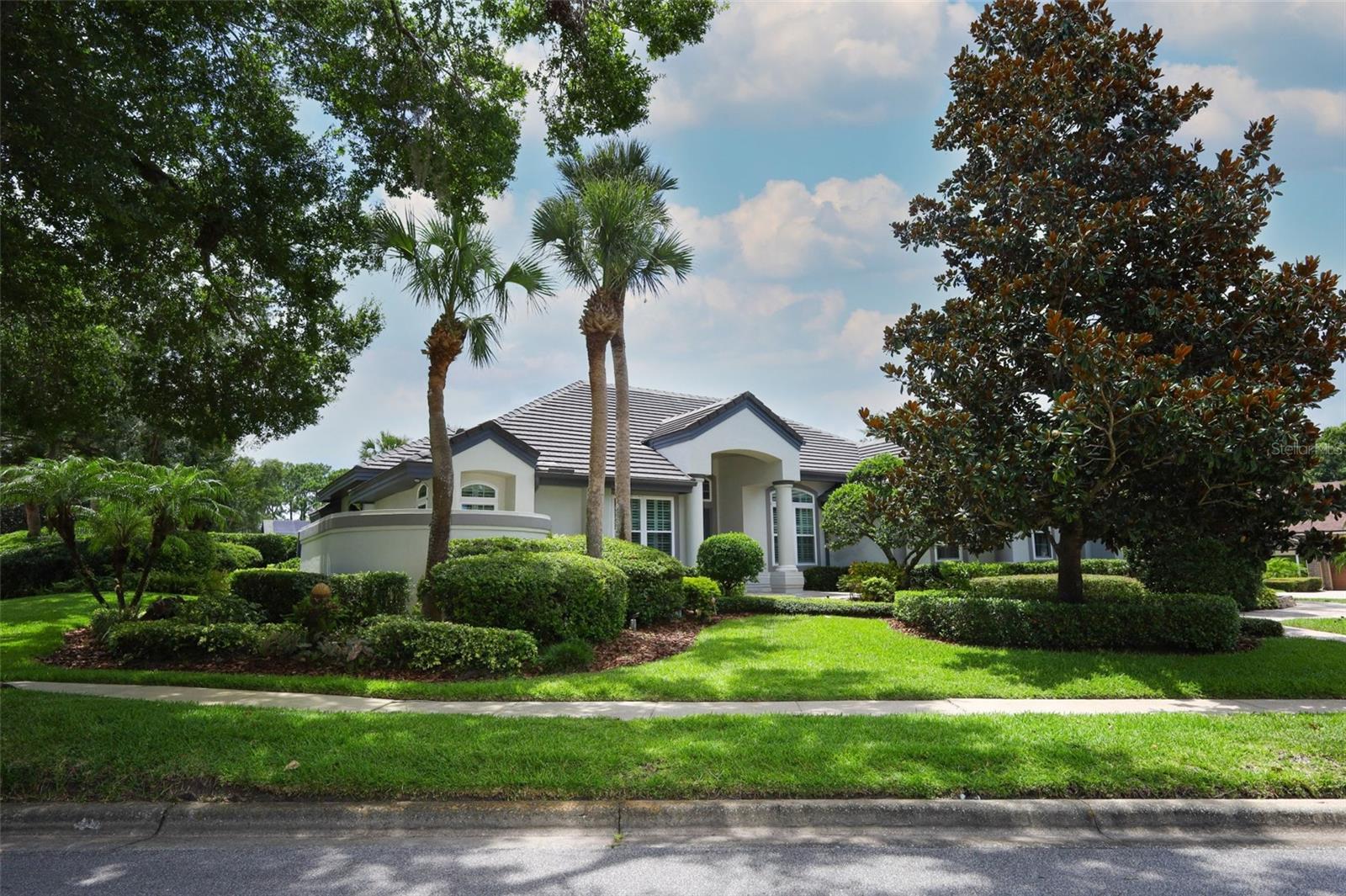 Located in Timicuan's Signature Cove, this custom built Dave Brewer home is located on a .41 acre corner lot showcasing the mature landscaping with a screen-in private pool/spa to enjoy outdoor barbecuing and socializing with family and friends. Move in ready is an understatement! This home is fully upgraded with tile roof and walkway pavers, new Simonton energy efficient/impact resistant replacement windows and sliders. Stunning "Chef" kitchen with Thermador appliances and Cambria quartz countertops. Home also includes spacious bedrooms, wood floors and 3 car oversized garage with new wind rated doors.