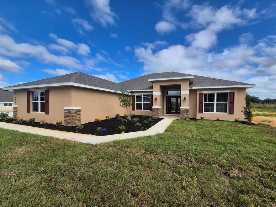 Explore the 2330 by Adams Homes. This 4-bedroom, 2-bath home features a spacious layout designed for comfortable living. A foyer opens to formal living and dining areas, while the family room flows into a modern kitchen with breakfast nook, walk-in pantry, and plenty of counter space. The master suite includes walk-in closets, dual vanities, and a relaxing soaking tub. With additional bedrooms, a laundry room, 2-car garage, and bright, airy spaces, the 2330 combines comfort, style, and practicality.The exterior has stone accents, and the garage doors have top-row windows for natural light. All three bathrooms echo the home’s upscale feel with matching granite counters and soft-close cabinetry. Additional upgrades include 5¼” baseboards, a 50-gallon water heater, double-pane low-E windows, and the peace of mind that comes with no flood zone concerns. Why wait to build? Your brand-new home in Hill Country Estates is ready now—beautifully finished, energy efficient, and move-in ready.
