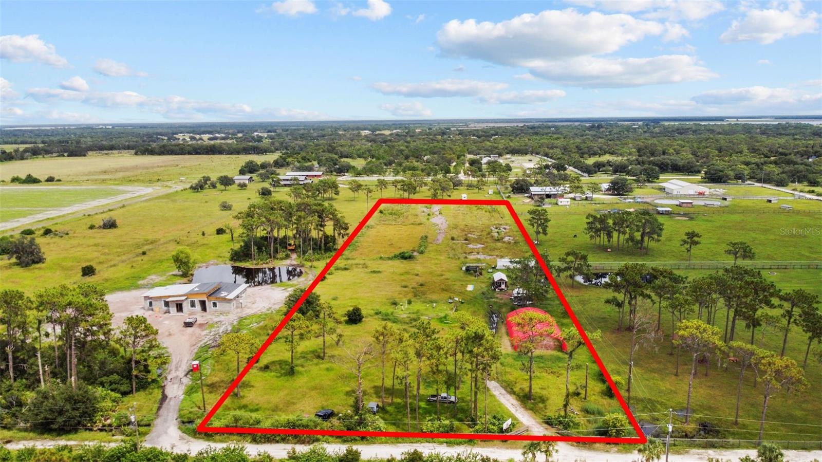 $20,000 Price Drop!! Own your own FARM?!! Ready to GROW and Manage YOUR own Commercial venture. Current Agricultural license in place.
BUILDABLE property not only offers OPEN SPACE but also features a 1,600 Sq Ft footing already in place (32ft x 50 ft). Equipped with a newly INSTALLED OVERSIZED WELL (2020) and an ELECTRICAL pole (2022) that powers the irrigation system, covering an area equivalent to four football fields, it's ideal for AGRICULTURAL USE or LANDSCAPE BUSINESS and/or BUILDING. Connected to PUBLIC SEWER and located outside of a flood zone, this lot offers peace of mind and convenience for development.
Surrounded by large lots, nurseries, and a neighboring horse farm, this parcel provides a unique blend of rural tranquility and practical amenities. Caretaker and large guard dog on premises. CURRENT DEPT OF AGRICULTURE HEMP LICENSE.