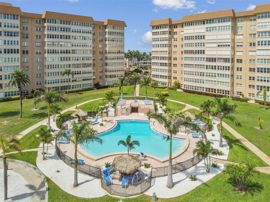 Step into an extraordinary lifestyle with this luxurious 2-bedroom, 2-bath corner unit in the serene enclave of Point Brittany. This rare gem offers panoramic wall-to-wall vistas overlooking the dazzling Boca Ciega Bay and Gulf. As you prepare dinner in your gourmet kitchen—equipped with updated stainless steel appliances, quartz countertops, and custom wood cabinetry—enjoy the spectacle of cruise ships and sailboats gliding through the bay along with dolphins and manatees, providing a daily show that transforms your home into a serene retreat. 

The expansive open-concept living space is tastefully remodeled, featuring quality materials and exceptional craftsmanship. The Florida room could even serve as a third bedroom. The master bedroom suite is nothing short of lavish, boasting an additional wall of closets with cove lighting above, and both bedrooms offer substantial walk-in closets. Each room in the home, even above the kitchen sink, offers stunning water views. The master bath is a personal sanctuary with oversized double vanity, wrap-around mirrors, and a walk-in tiled shower. The guest bath features quartz counters, a large mirrored wall, and an ample custom wood linen closet.

Living in this corner unit means you'll enjoy tons of natural light, newer hurricane-rated windows, a storage unit, and a reserved, covered parking spot. Commercial Speed Queen washers and dryers are available at no charge on each floor for your laundry needs. The building has passed its 2023 Structural Milestone Inspection, adding peace of mind to its extensive list of perks.

Beyond the walls of this stunning condo, Point Brittany offers unparalleled amenities. Dive into luxury with four heated pools, a hot tub, a well-equipped fitness facility, yoga & dance studios, and a wide array of sports facilities from tennis to pickleball. If you're in the mood for a quiet evening, you can relax by the large fire pit at the picnic pavilion or even enjoy a kayak ride from the dedicated storage and docking area. The community offers 24-hour security, and there's even an elegant clubhouse complete with a commercial catering kitchen, making it ideal for social gatherings. An on-site medical clinic, a salon, and a New York-style deli add convenience to this idyllic lifestyle.

Located just minutes away from the sugar sands of St. Pete Beach and Fort DeSoto State Park, this condo is also a short drive from the vibrant arts and culture of downtown St. Petersburg. With Tampa, Clearwater, and the airport only 25 minutes away, you are always close to everything you need. Point Brittany is a 55+ community where at least one homeowner or resident per unit must be 55 or older. Some furnishings are available for purchase.

Take advantage of this golden opportunity to live on your terms, surrounded by beauty and luxury. Your extraordinary life starts right here in Point Brittany.