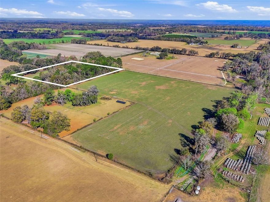 Discover a rare opportunity to own 5+ acres in beautiful Alachua, Florida, offering the perfect canvas for your forever home. Located in a peaceful farm community in North Florida, this high-and-dry, Agricultural-zoned property is thoughtfully cleared and ready for your vision. With no HOA and no deed restrictions, you’ll enjoy the flexibility and freedom to build exactly what you’ve been dreaming of. Privately tucked away for peace and seclusion, this spacious property provides the ideal setting for a custom home, small farm, homestead, or private country retreat. Surrounded by the natural beauty and quiet charm of Alachua, the property offers the tranquility of rural living while remaining conveniently close to modern amenities. Looking for even more space? Three additional adjoining parcels are also available, giving buyers the unique opportunity to purchase all four parcels together for over 20 acres, creating a private estate, family compound, or expansive farm. Enjoy the best of both worlds — serene country living just minutes from the Santa Fe River, I-75, nearby shopping, medical facilities, and an easy commute to Gainesville for work, dining, and entertainment. Opportunities like this are becoming increasingly rare — combining acreage, versatility, privacy, and convenience in one exceptional North Florida offering. Build the sanctuary you’ve always envisioned and experience the charm and tranquility that make Alachua such a special place to call home.