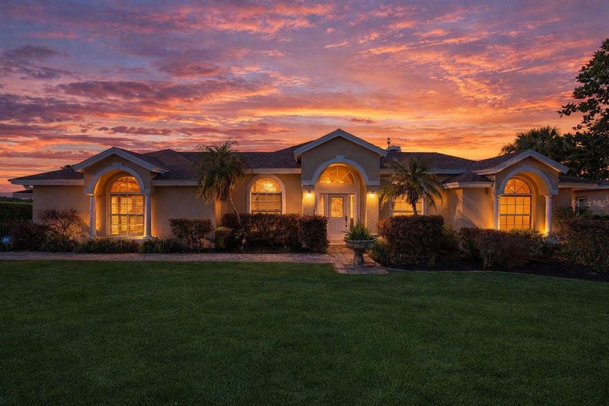 One or more photo(s) has been virtually staged. Welcome to a rare opportunity in the prestigious Magnolia Island community, a lakefront estate on the highly sought-after Johns Lake Chain offering 1.37 acres of space, privacy, and breathtaking sunset views. This 5-bedroom, 4-bath residence is perfectly positioned with direct lake frontage and a floating dock, making it ideal for boating, entertaining, and embracing the true Florida waterfront lifestyle. From the moment you enter, you’re greeted by formal living and dining spaces that set the tone for both elegance and functionality, while the tri-split floor plan provides exceptional privacy and flexibility for everyday living or hosting guests. The kitchen features granite countertops and newer appliances, seamlessly connecting to the main living areas and overlooking the screened pool and expansive lake views. The home is move-in ready and beautifully maintained, while still offering the perfect canvas for a buyer to bring their own modern vision and personalized updates to elevate it to the next level. Designed for versatility, the 5th bedroom serves as an ideal in-law suite or private guest retreat with its own bathroom and covered patio access. The primary suite is a true retreat, featuring brand-new hardwood flooring, a large walk-in shower with a soaking tub, dual half baths, and a spacious walk-in closet. Throughout the home, you’ll find a blend of hardwood and tile flooring, along with a newly refurbished fireplace that adds warmth and character. Step outside to your private screened lanai and pool area, where wide-open lake views and some of the most stunning sunsets in Clermont create an unforgettable setting. The 3-car garage includes a third bay equipped with a mini-split AC—perfect for a workshop, gym, or climate-controlled storage.
Significant updates provide peace of mind, including a new roof (March 2026), new pool pump (2026), replumbed (2024), and recent exterior/interior paint. Adding to the home’s appeal, the community boat ramp and dock are located immediately adjacent to the property, offering unmatched convenience for lake access. Ideally located just minutes from shopping, dining, hospitals, the Florida Turnpike, and Montverde Academy, this property combines luxury, location, and lifestyle. Whether you're looking for a move-in ready lakefront home or the opportunity to create a custom luxury masterpiece, this Magnolia Island estate delivers both. *Aerial photo property lines are an estimate and to be verified by buyer.