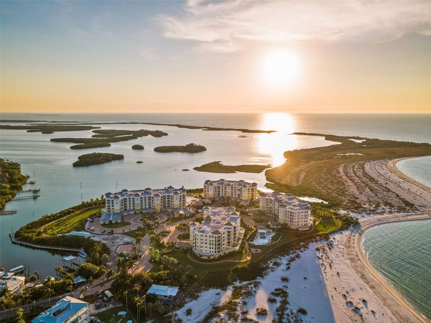 Welcome to island resort life at the exclusive gated Gulf front community of Sunset Pointe at Collany Key. Only six years old, Sunset Pointe is an owner’s dream. This luxurious, gated community complete with its own private beach is on the island of Tierra Verde and
shares its adjacency with Shell Key, an 1,800 acre Preserve and one of Pinellas County’s largest undeveloped barrier islands. Upon arriving at residence 406 you will enter directly into your private foyer by secured elevator. Step inside and you will be amazed with spectacular views overlooking the Gulf of Mexico and Pass-a-Grill. Enjoy amazing sunsets from the wrap-around balcony facing West. This RARELY available END-UNIT has three bedrooms and three bathrooms plus one-half bath. This home also comes with a PRIVATE TWO CAR GARAGE and an additional air-conditioned storage room. The spacious kitchen has custom wood cabinetry with plenty of storage, soft closing drawers and all stainless-steel appliances. The kitchen opens to a bright dining area surrounded by windows and views that will take your breath away. An open floor plan designed for entertaining with stunning panoramic vistas from every window including the floor-to-ceiling
sliders are impact glass to ensure peace of mind which opens to two separate and private patios. Incredible amenities include: a Geo-thermal salt-water pool that is beachside, a saltwater hot tub, multiple barbecue facilities, firepit, fitness center next to the pool, kayak storage with floating launch plus fishing pier and a walking trail that will surround the property when complete. Along with the regular amenities you will enjoy the AMAZING Sunset Pointe Pavilion with two bocce ball courts and a seven-hole putting and chipping green! From Sunset Pointe you can enjoy quick access to downtown St. Petersburg with fine dining, art galleries, museums, and luxury shopping! Owner has put in new wood tile flooring and upgraded neutral carpet in the bedrooms so check out the new photos and call to see today!