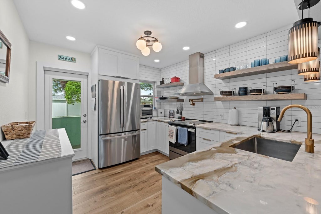 Photo of 436 Norfolk Street, Dunedin, FL 34698 (MLS # TB8543811)